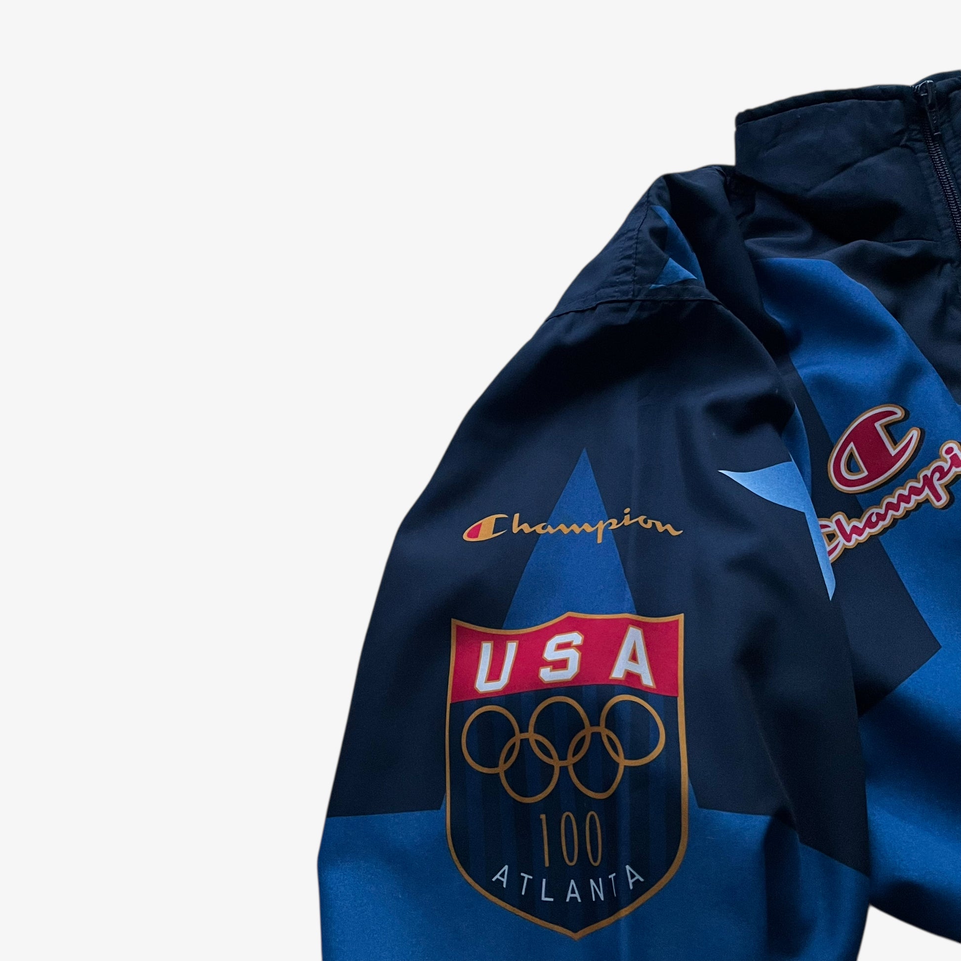Atlanta games print on vintage 90s men's Champion 1996 USA Olympic team star patterned navy track jacket.