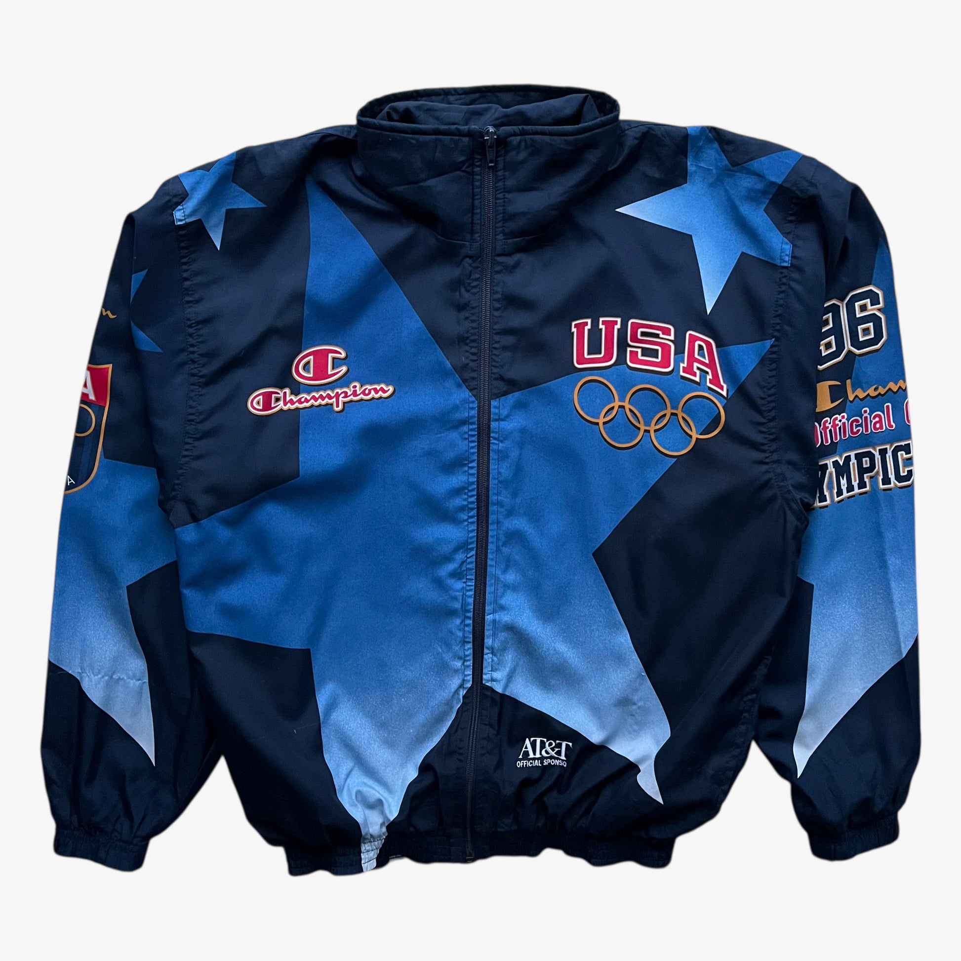 Vintage 90s men's Champion 1996 USA Olympic team star print navy track jacket.