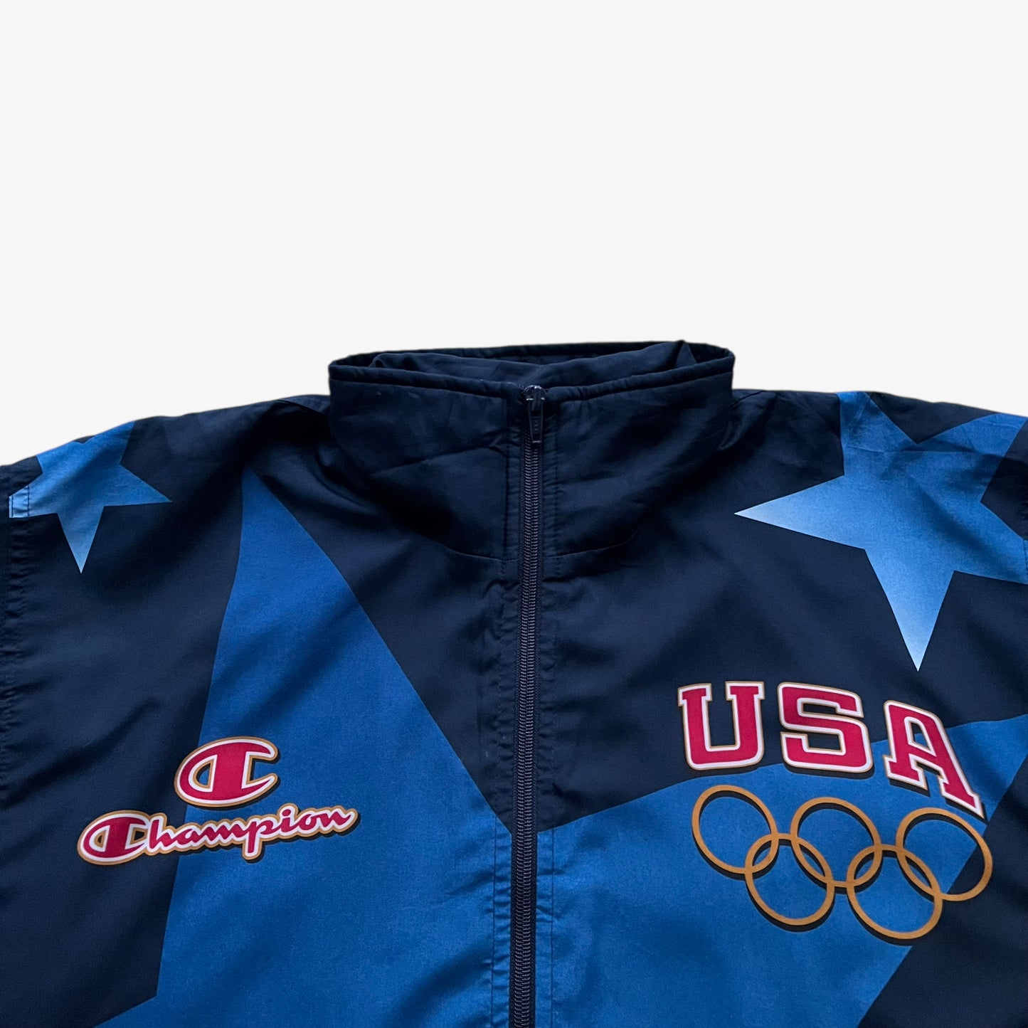Printed spell out logo on vintage 90s men's Champion 1996 USA Olympic team star print navy track jacket.