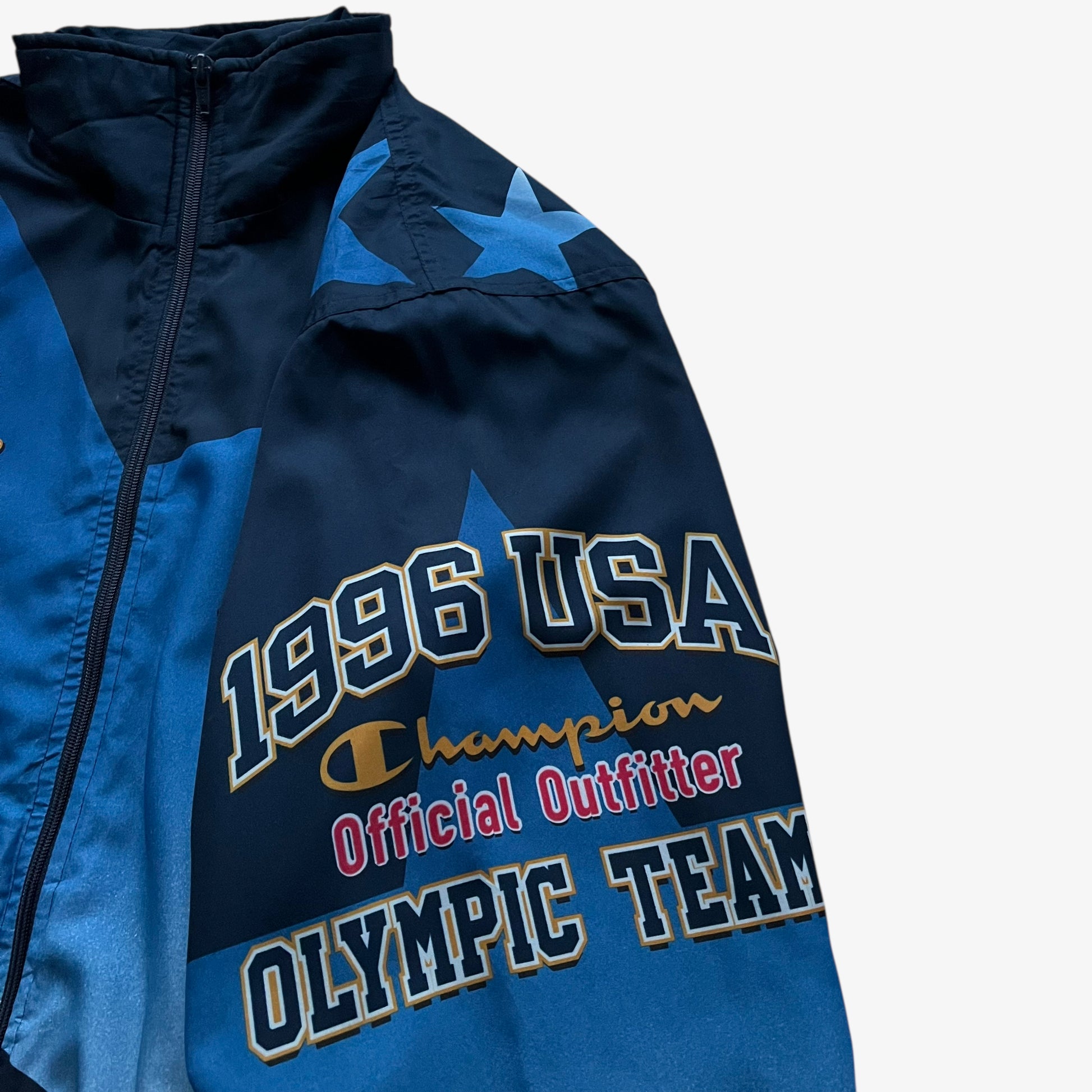 Official vintage 90s men's Champion 1996 USA Olympic team star print navy track jacket.
