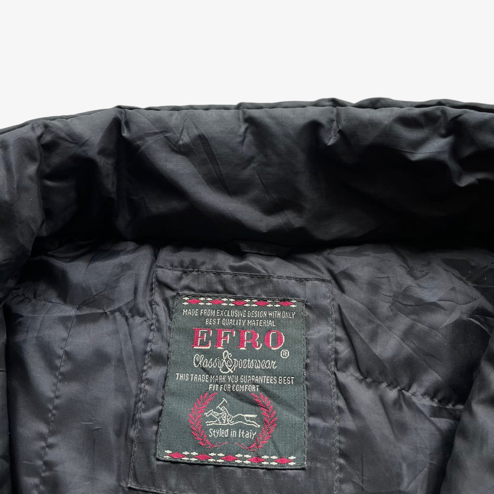 Efro label stitched inside of vintage 90s men's baseball world series championship black gilet with back embroidered spell out.