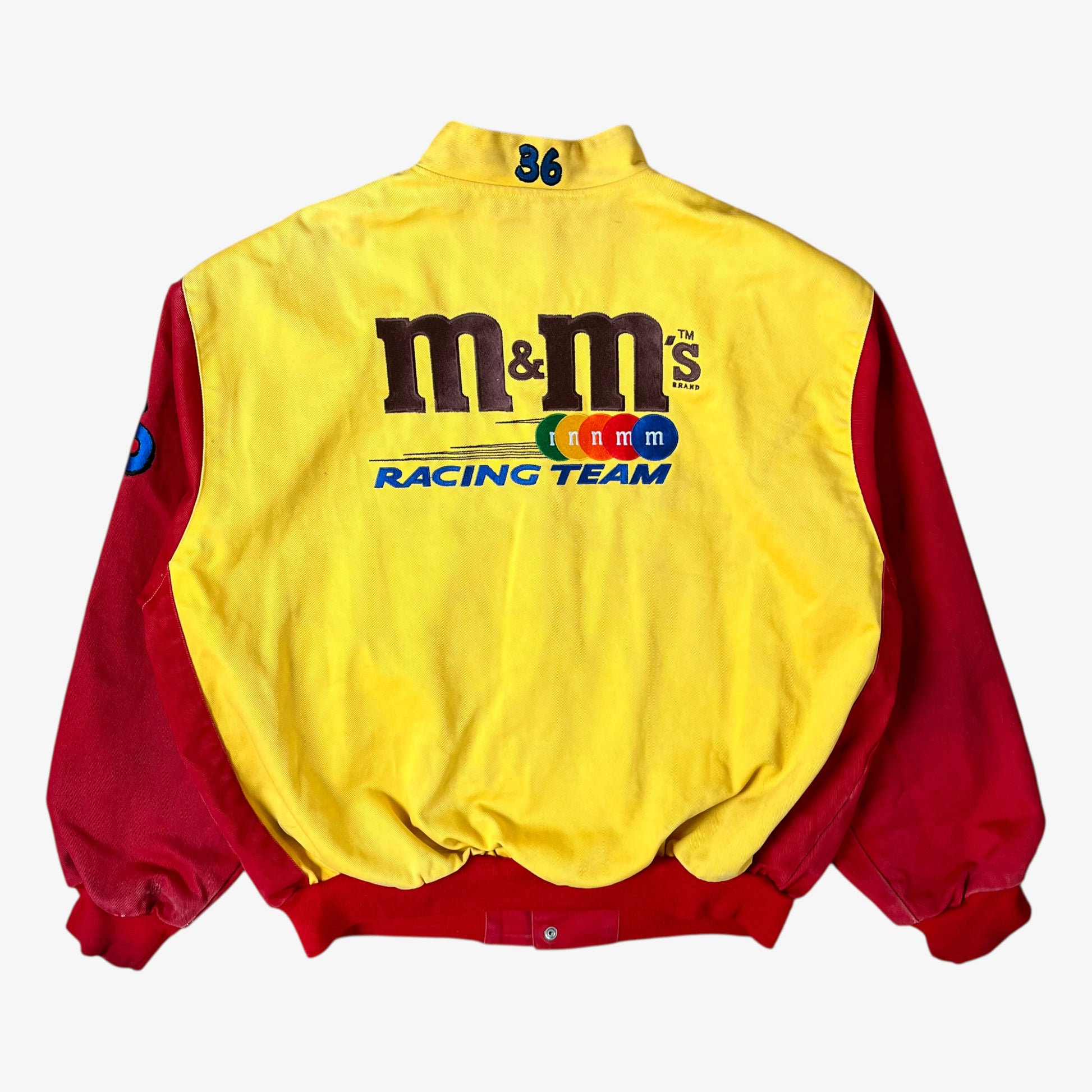 Back of vintage 90s Jeff Hamilton JH Design Ernie Irvan 36 M&M yellow NASCAR jacket.