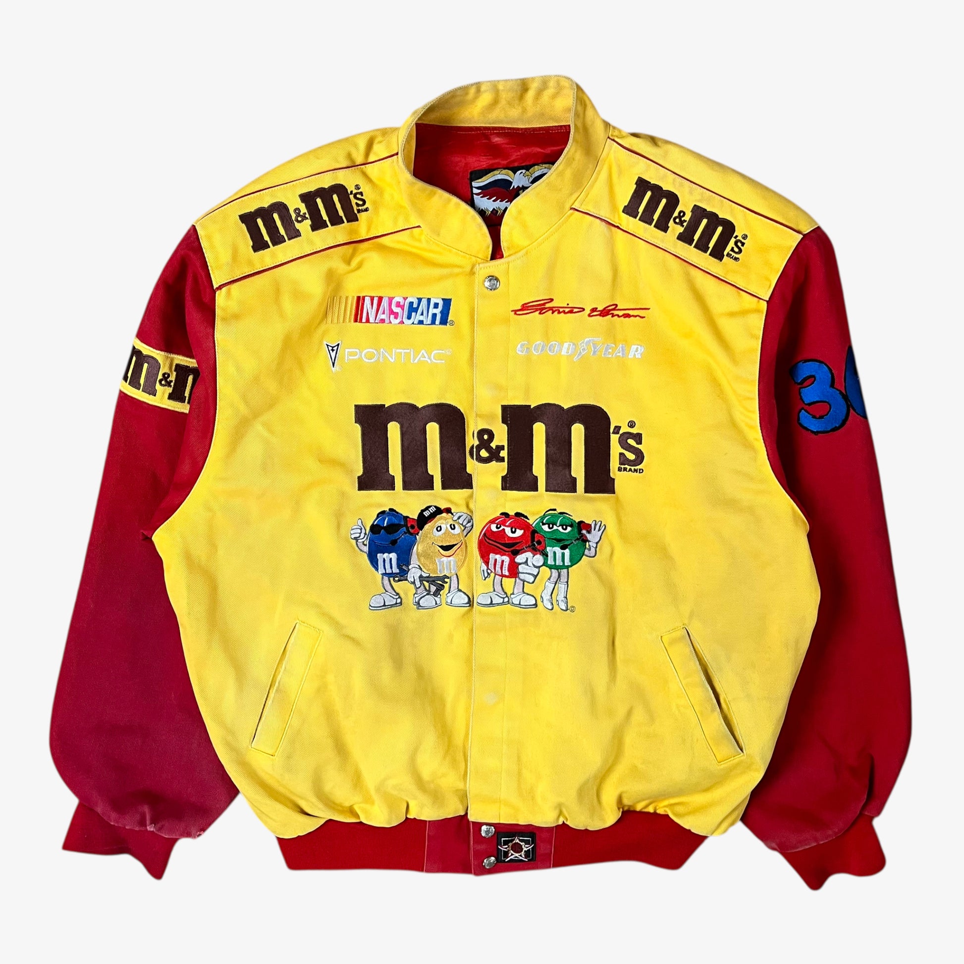 Vintage 90s Jeff Hamilton JH Design Ernie Irvan 36 M&M yellow NASCAR jacket with bold embroidered logos and retro racing style.