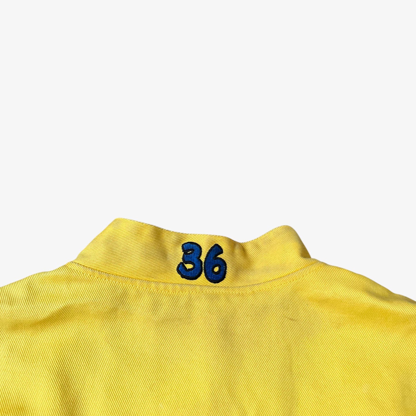 Collar of vintage 90s Jeff Hamilton JH Design Ernie Irvan 36 M&M yellow NASCAR jacket.
