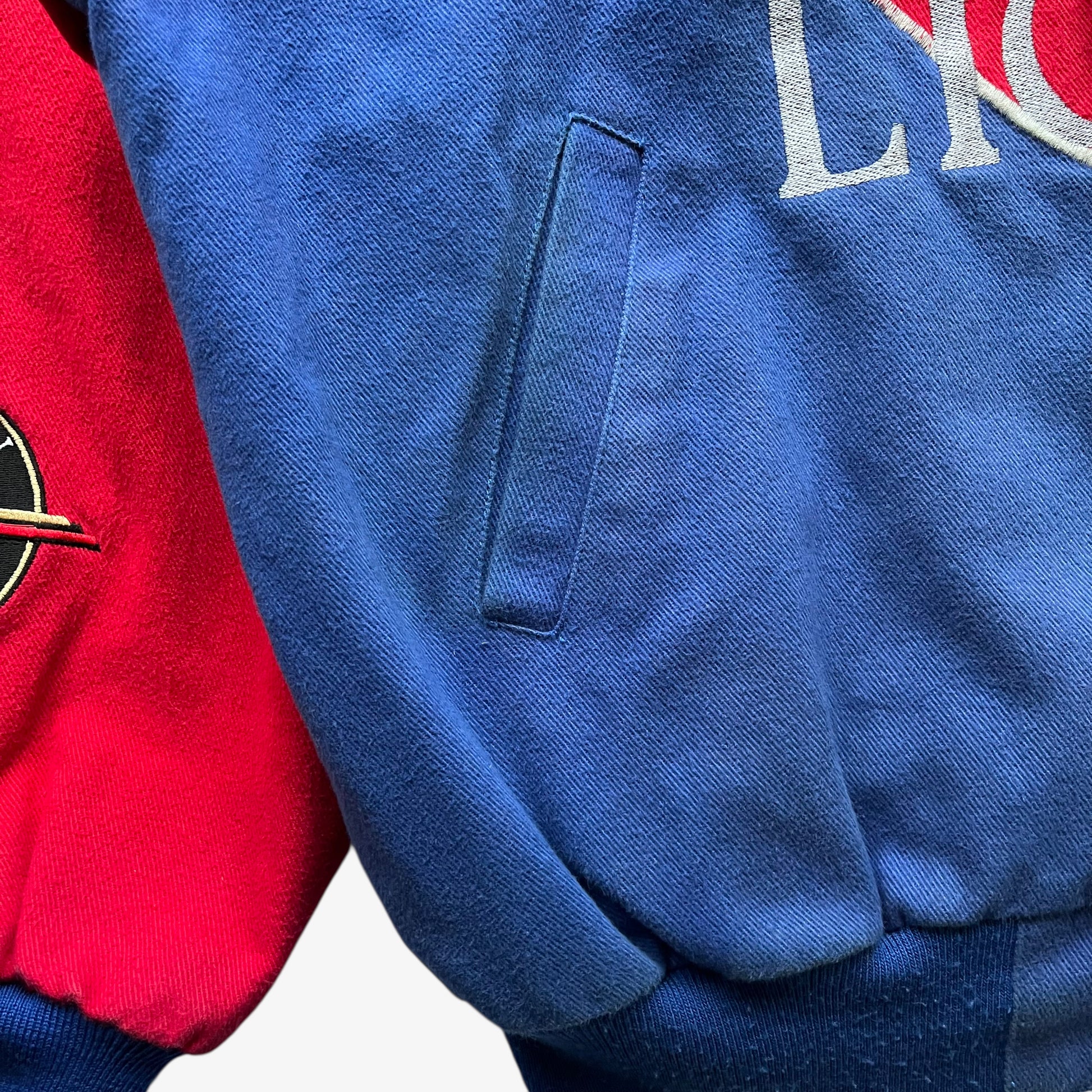 Patina on the pocket of a vintage 90s men's Jeff Hamilton Coors Light silver bullet nascar jacket.