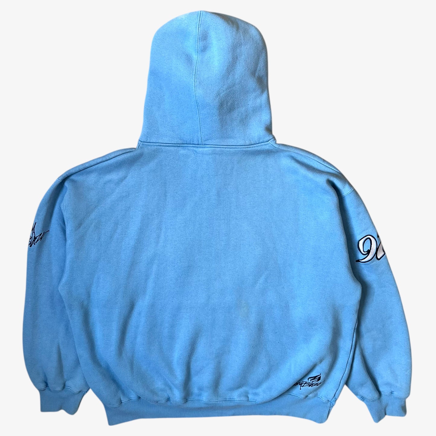 Back of vintage 90s men's Johnny Blaze blue hoodie.