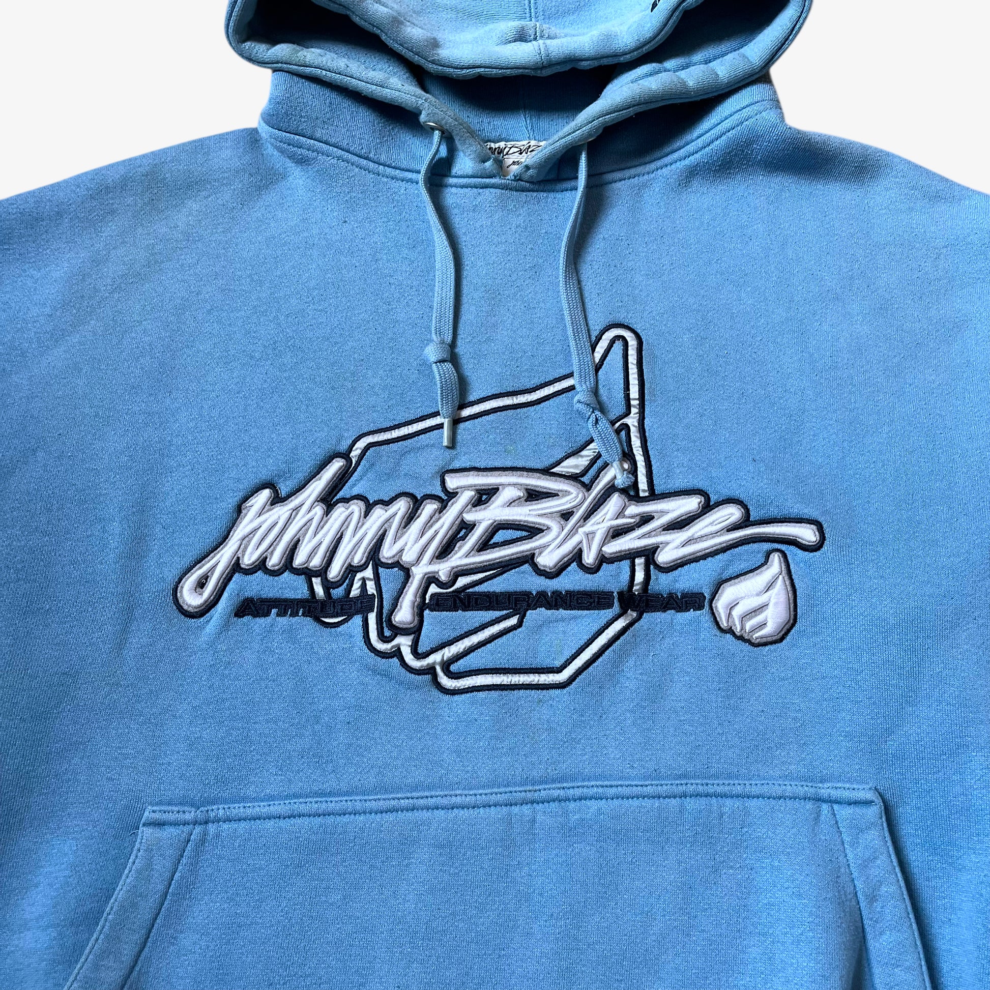Close up of a Johnny Blaze embroidered 3D spell out on a vintage 90s men's blue hoodie.