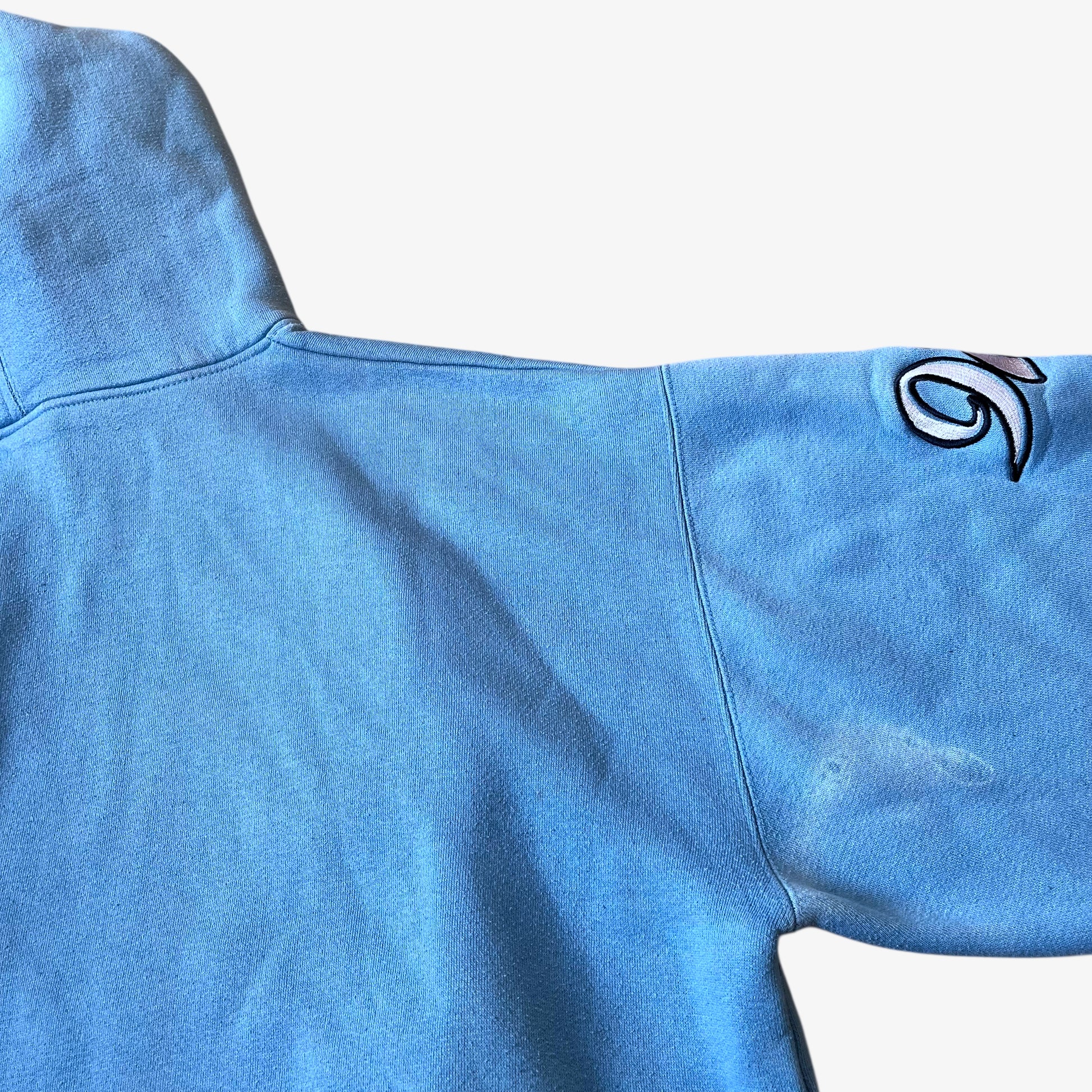 Wear on the back of vintage 90s men's Johnny Blaze blue hoodie.