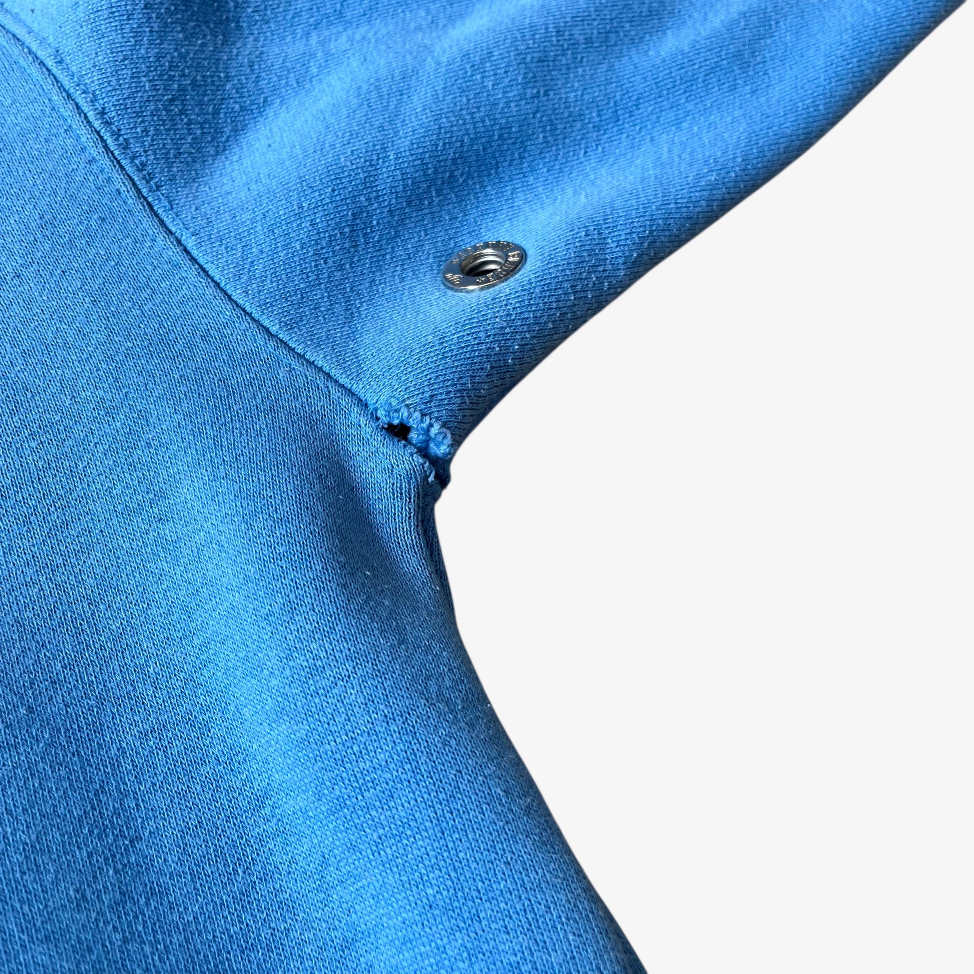 Wear underneath armpit of a vintage 90s men's Johnny Blaze blue hoodie.