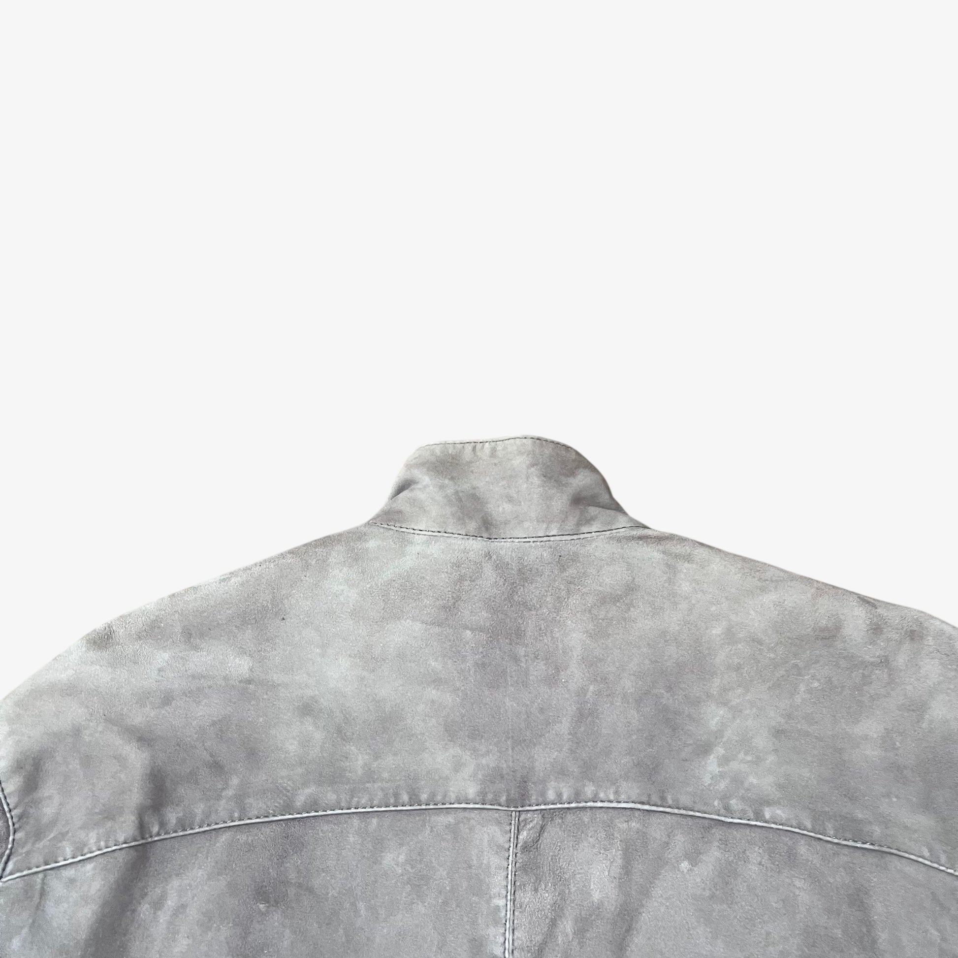 Collar of vintage 90s Just Cavalli men’s faded beige leather jacket.