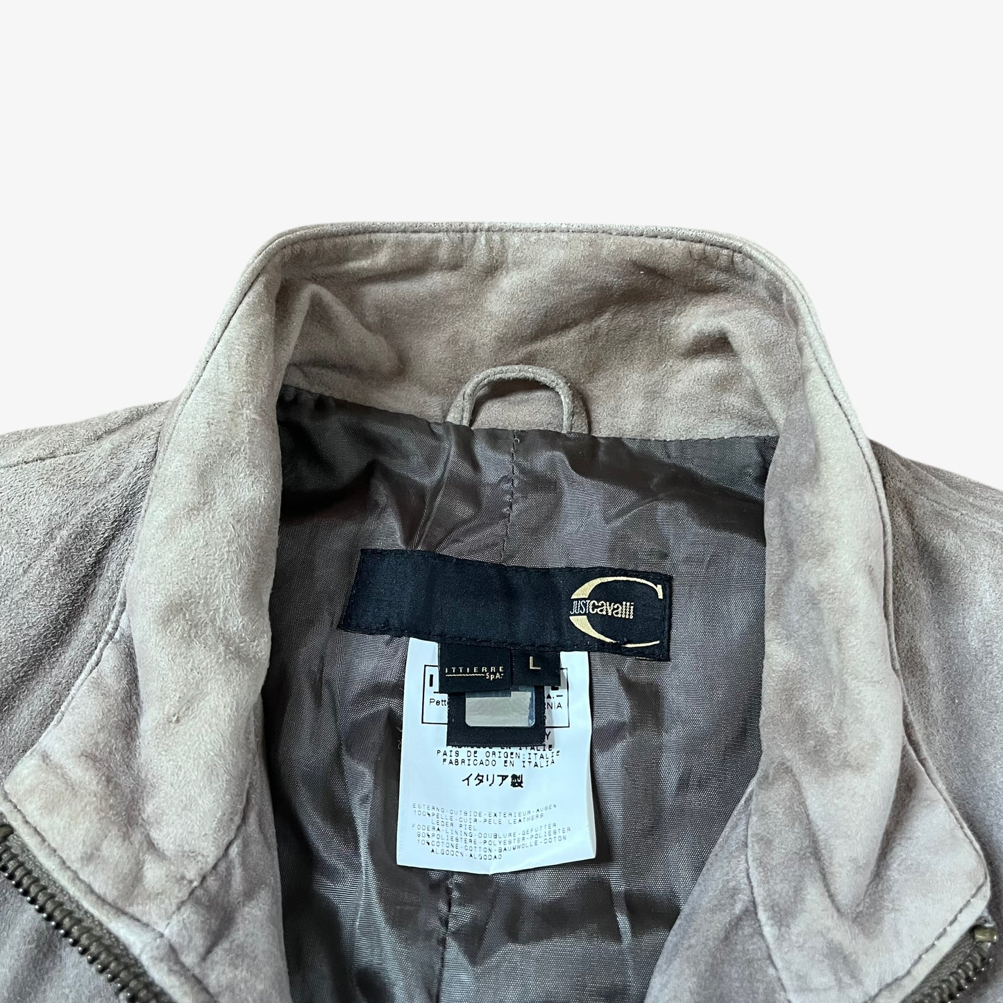 Label of vintage 90s Just Cavalli men’s faded beige leather jacket.