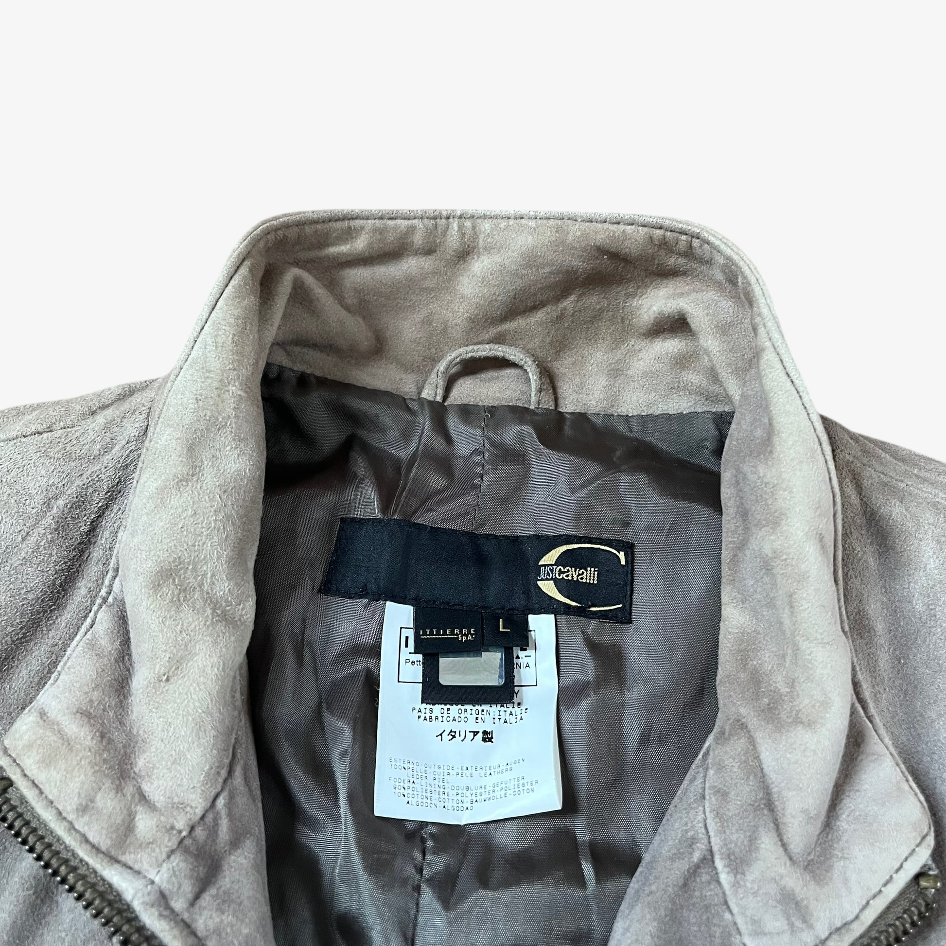 Label of vintage 90s Just Cavalli men’s faded beige leather jacket.