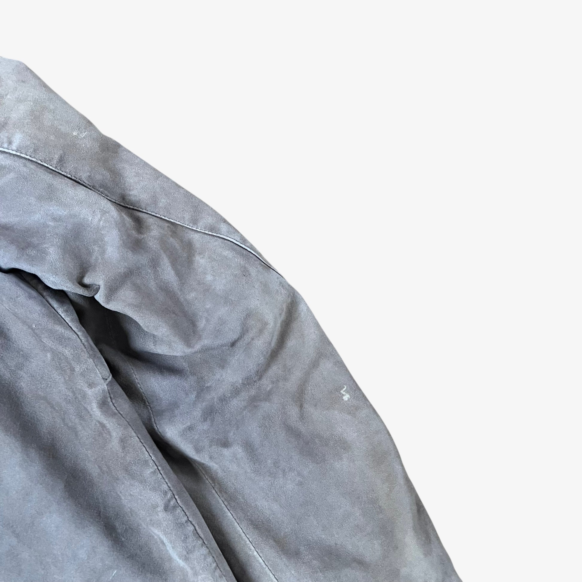 Sleeve of vintage 90s Just Cavalli men’s faded beige leather jacket.