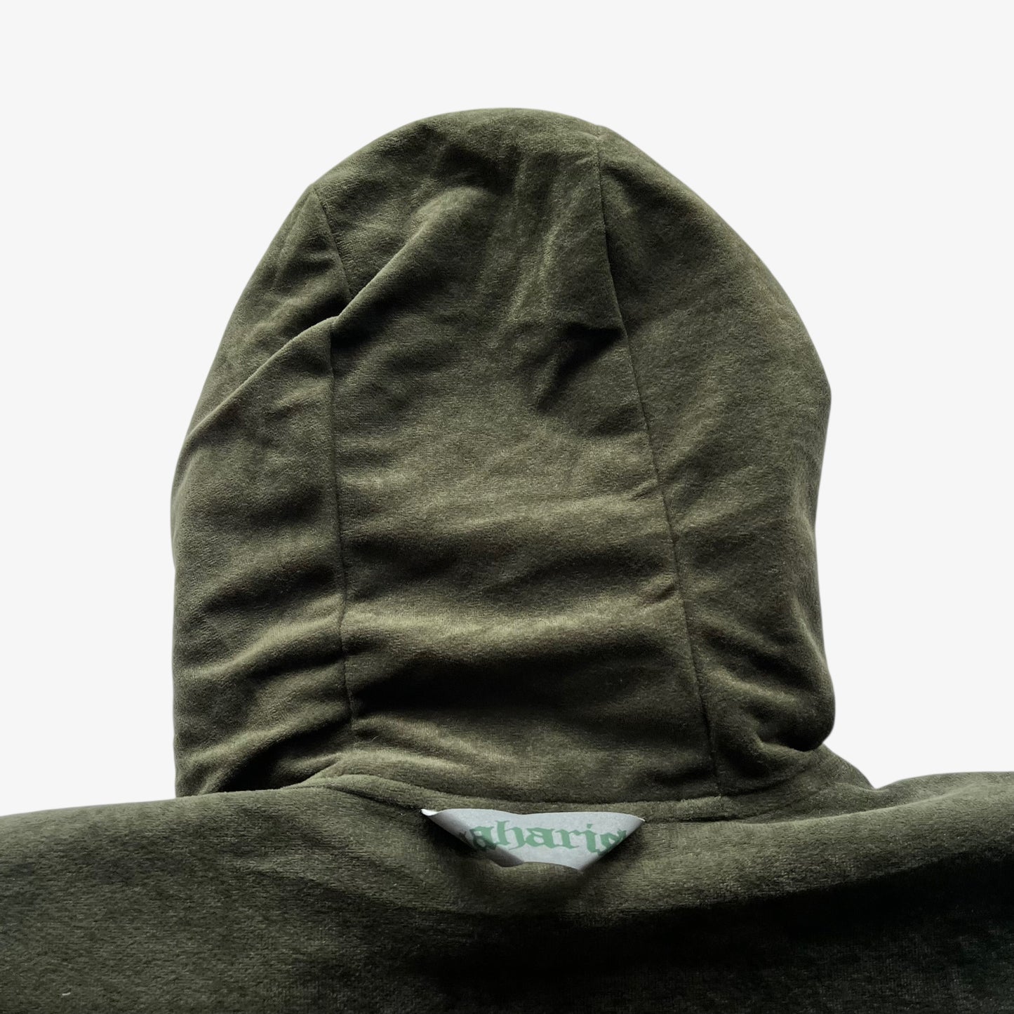 Khaki hood with a vintage 90s Maharishi brand tag attached.