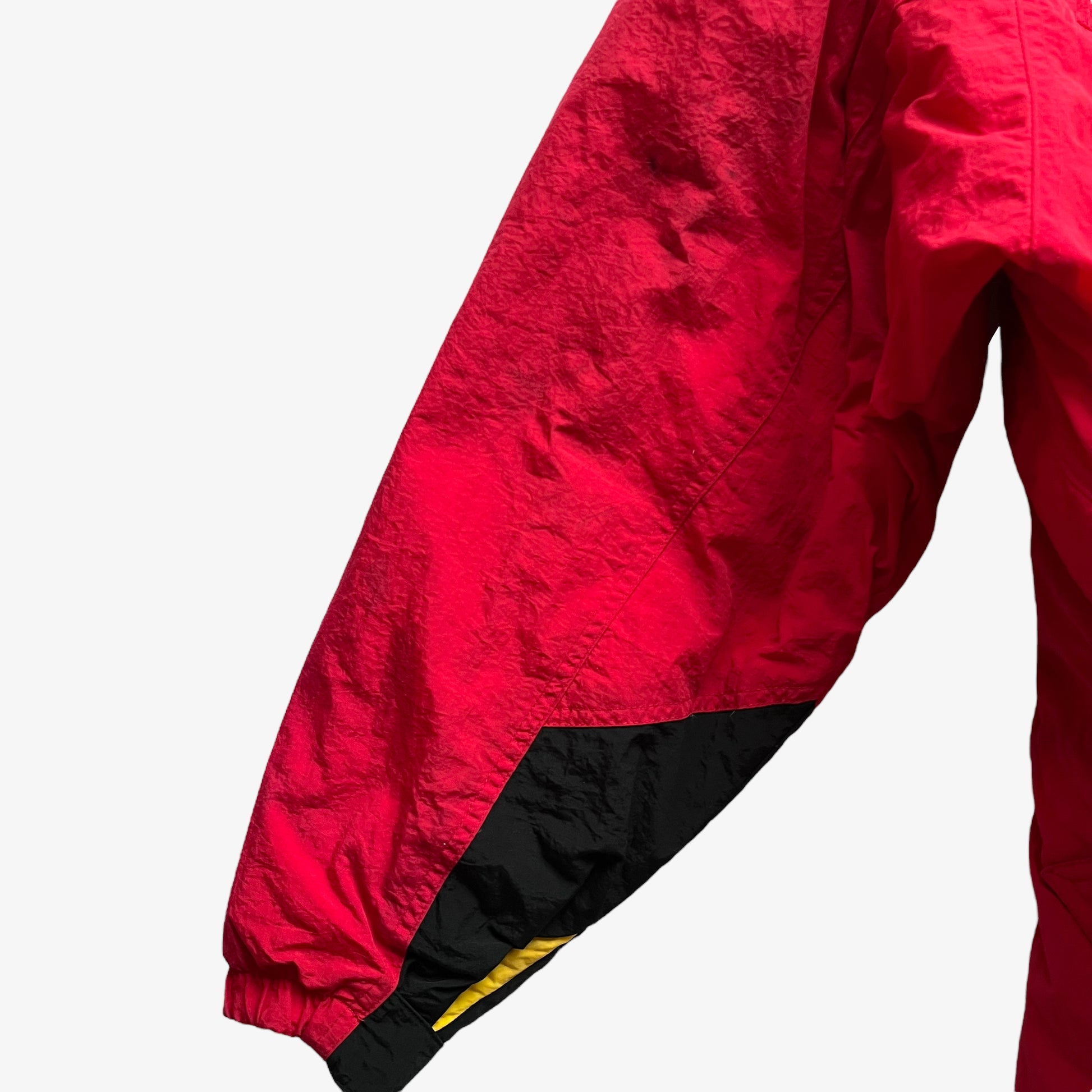 Sleeve of vintage 90s men's Marlboro country store red hooded puffer jacket.