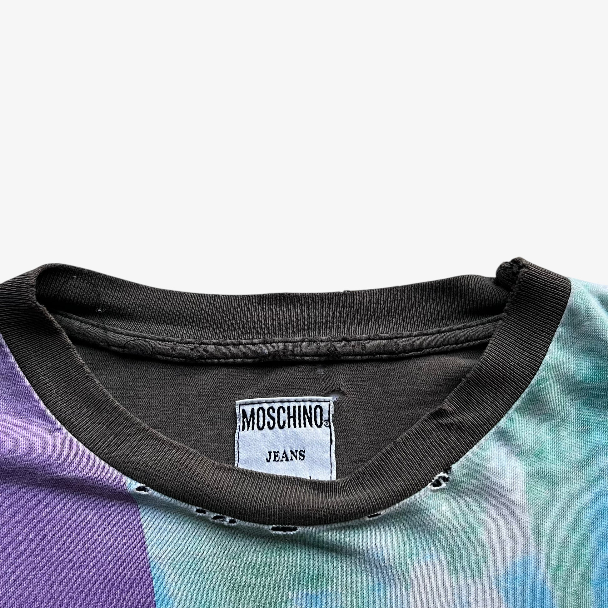 Moschino Jeans label stitched inside of men's vintage 90s no war but love cowboy print t-shirt.