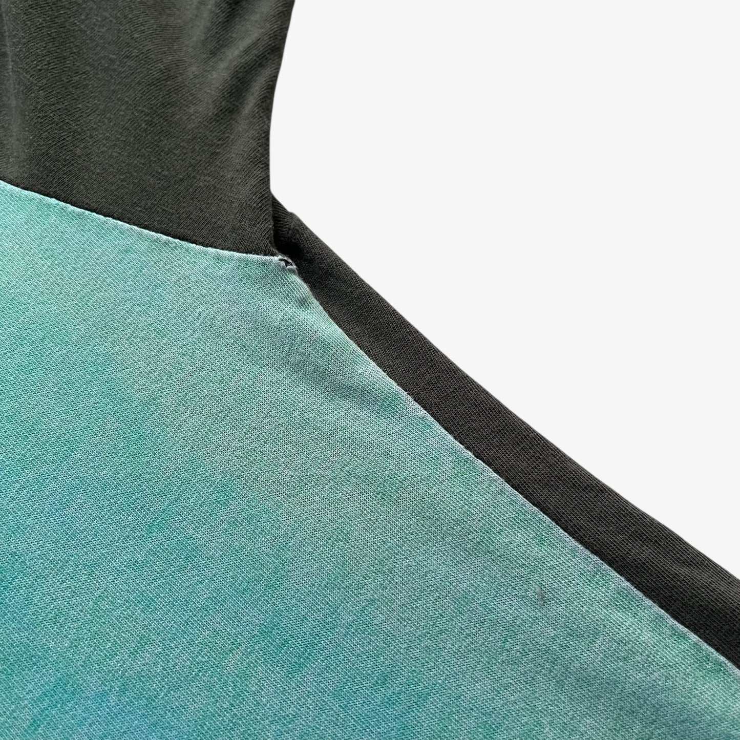 Patina on men's vintage 90s Moschino Jeans no war but love cowboy print t-shirt.