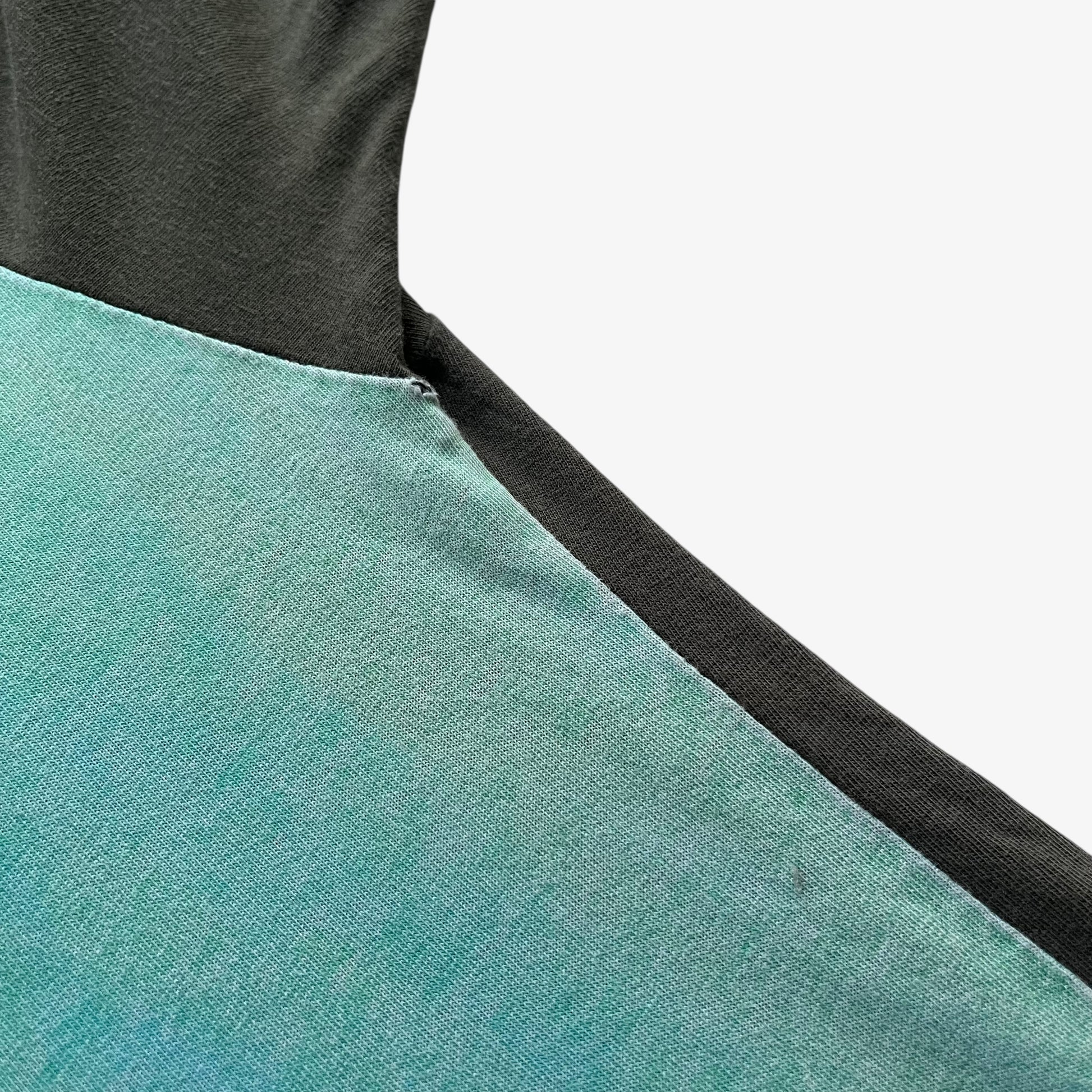 Patina on men's vintage 90s Moschino Jeans no war but love cowboy print t-shirt.