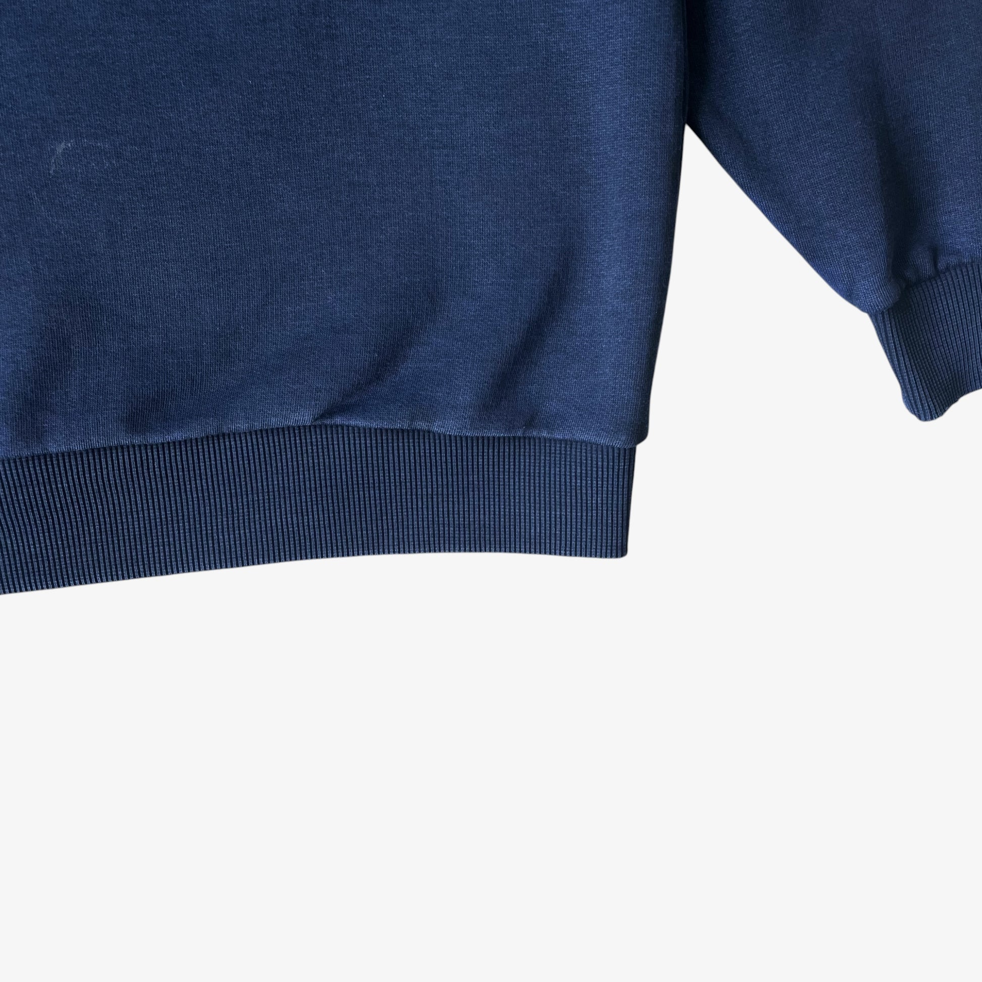 Close up of the ribbed cuffs on a vintage Nike Premier PSG navy sweatshirt.