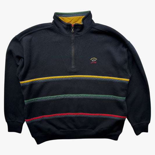 A Paul and Shark navy quarter-zip wool fleece with horizontal stripes in yellow, green, and red across the chest, featuring a small embroidered logo on the left chest.