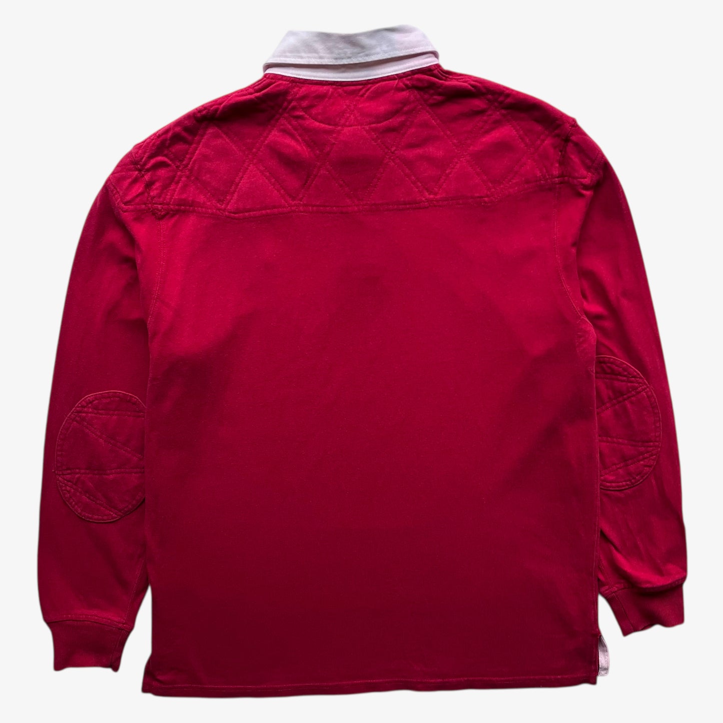 Back of vintage 90s men's Polo Ralph Lauren red rugby shirt with contrasting collar.