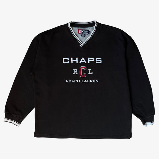 Men's vintage black sweatshirt with CHAPS and Ralph Lauren embroidered spell out on a white background.