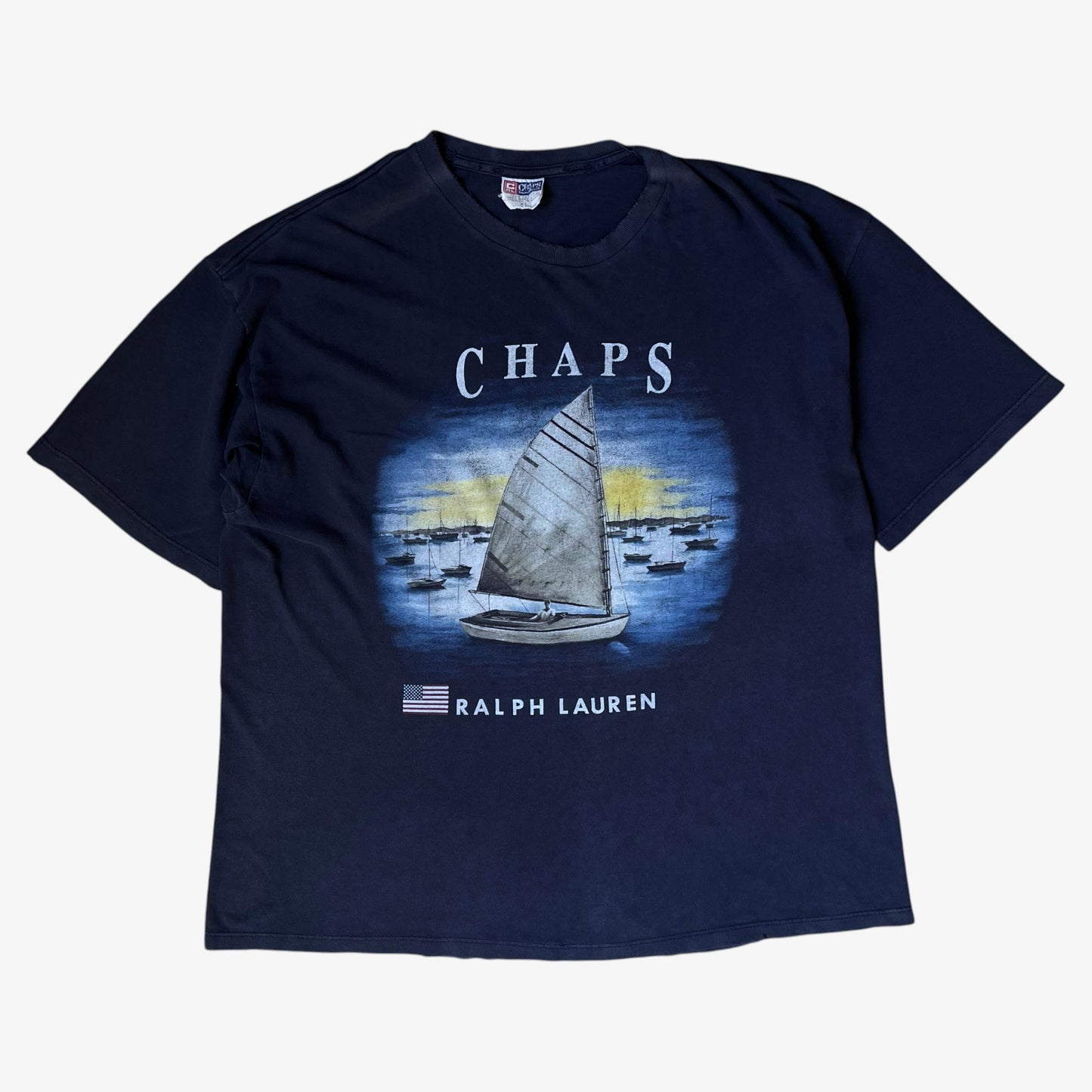 Vintage men's navy thrashed t-shirt with sailing boat graphic and Ralph Lauren Chaps spell out.