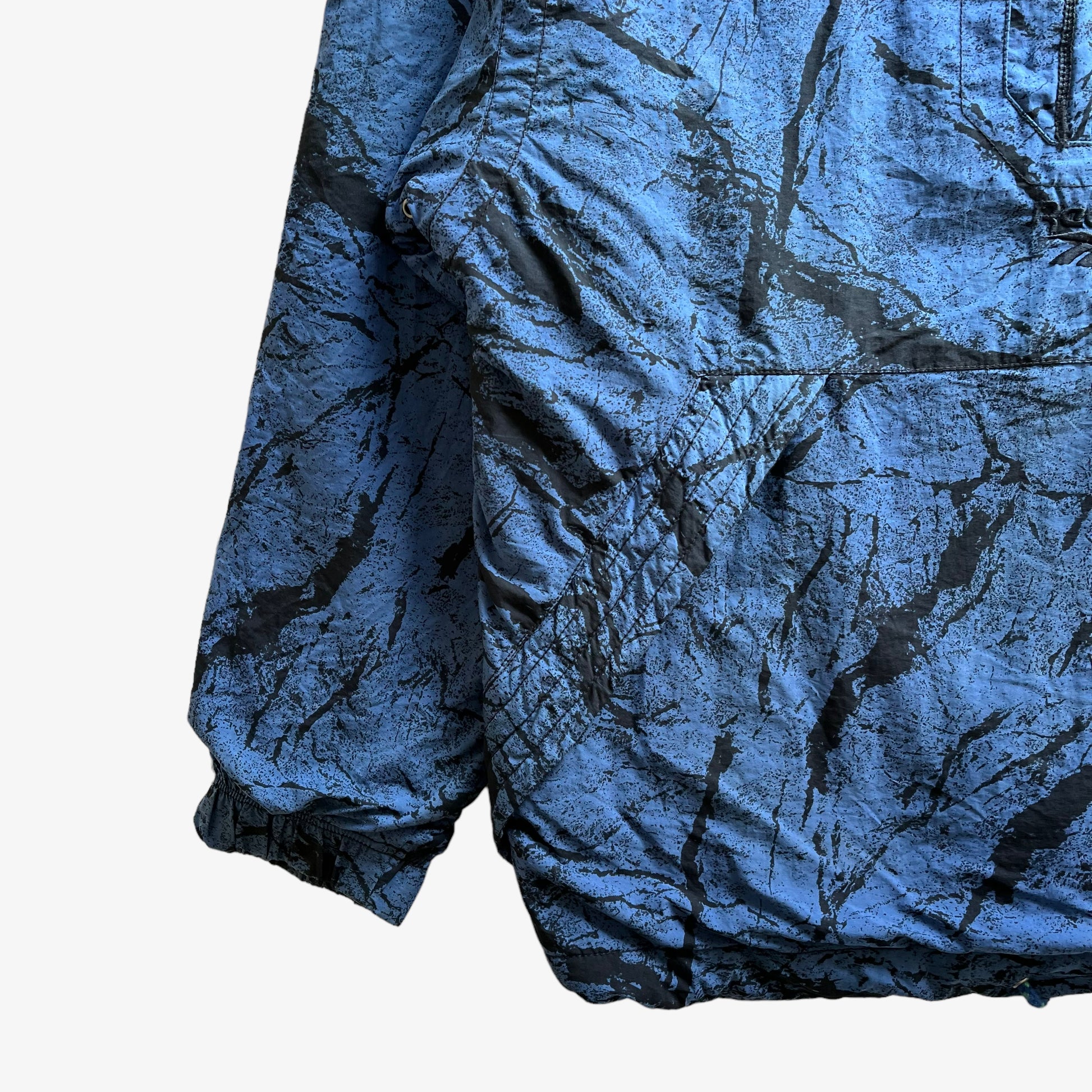 Vintage 90s Mens Reebok Blue Quarter Zip Pullover With Back Abstract Graphic Print Cuff - Casspios Dream
