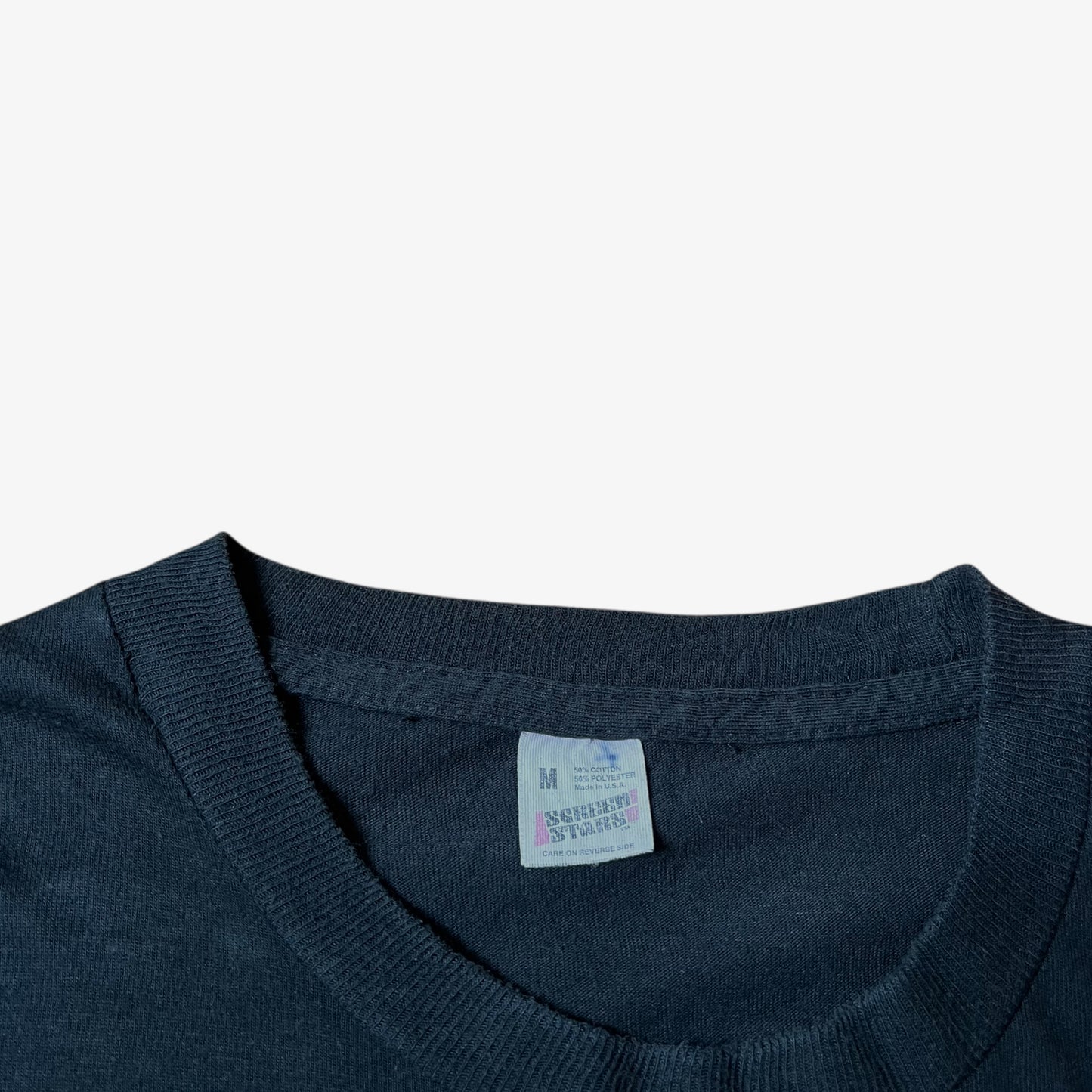 Screen Stars label stitched inside of a vintage 90s men's MTV Jackass Johnny Knoxville print black single stitch t-shirt.