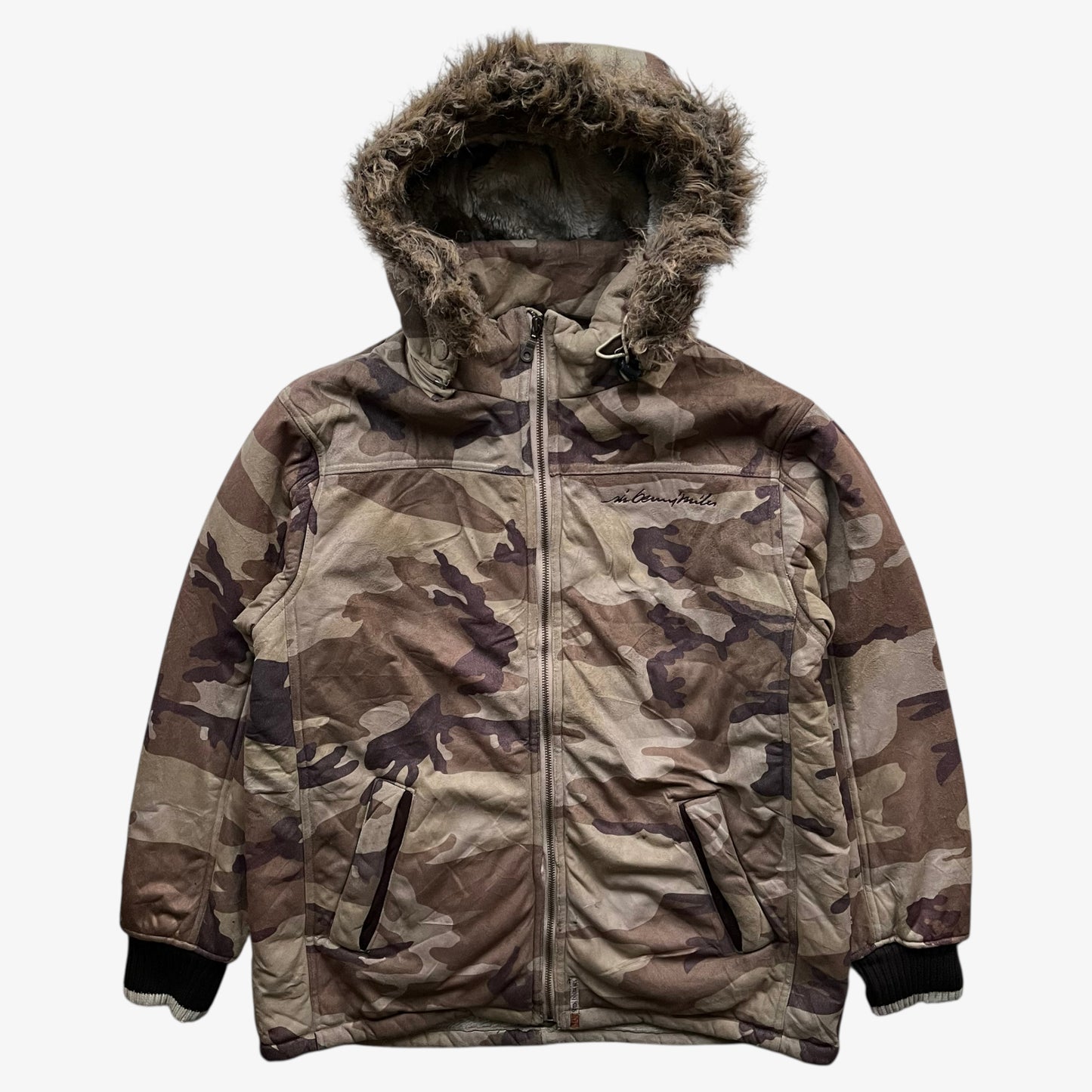 Vintage 90s men's Sir Benni Miles green camouflage jacket featuring a faux fur hood.