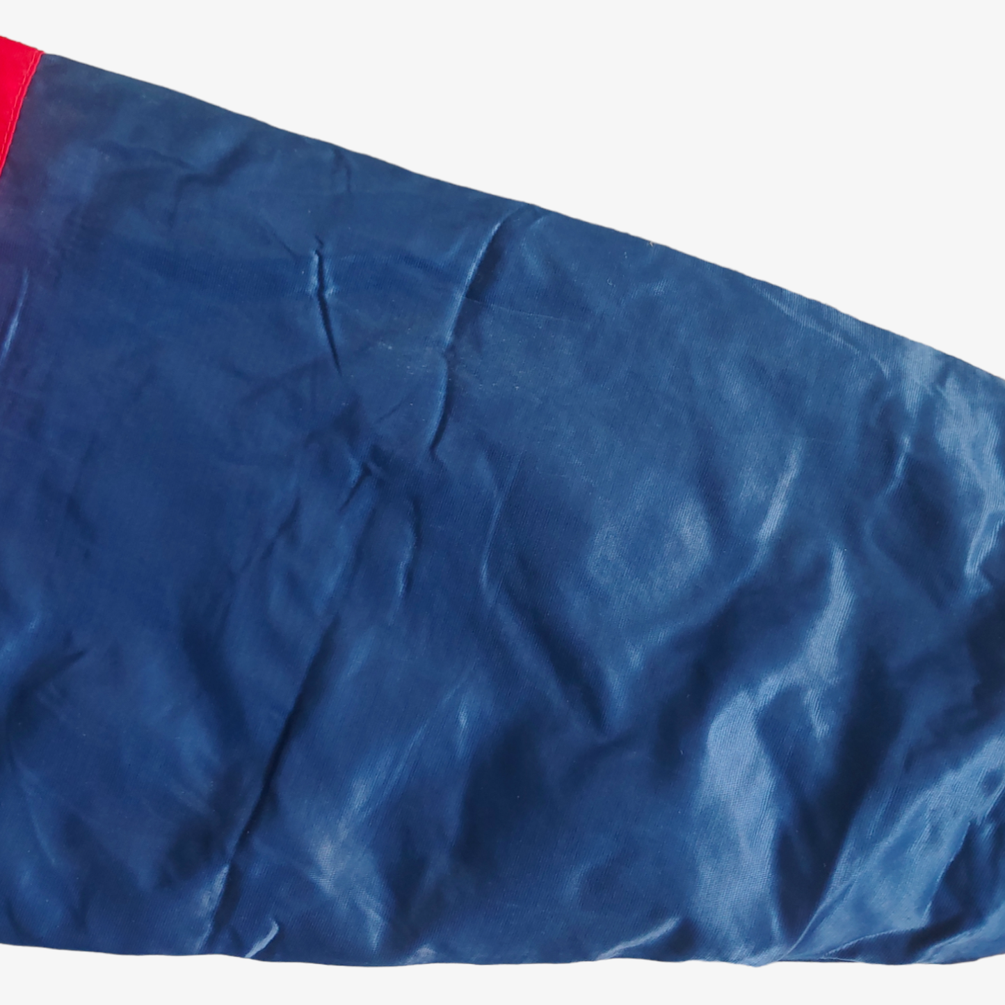 Sleeve on vintage Starter MLB Cleveland Indians jacket in blue with red and white accents.