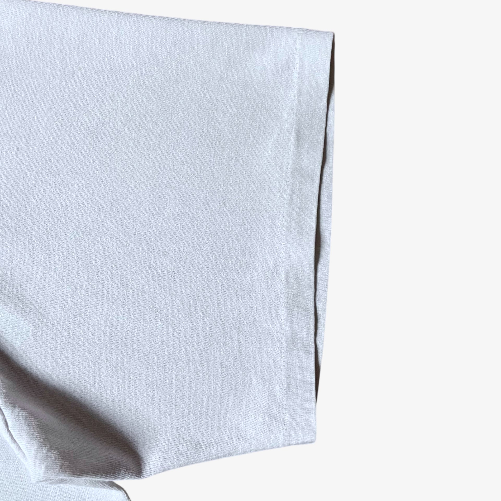 Single stitch short sleeve of vintage 90s men's Stussy studio Jamaica reggae dance hall print white thrashed t-shirt.