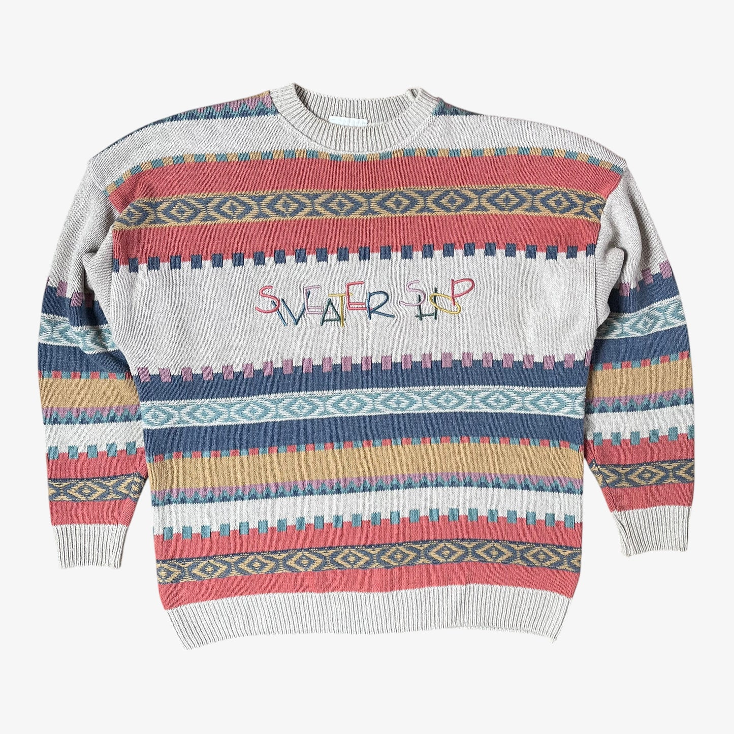 Colourful patterned sweater with 'Sweater Shop' text on a white background