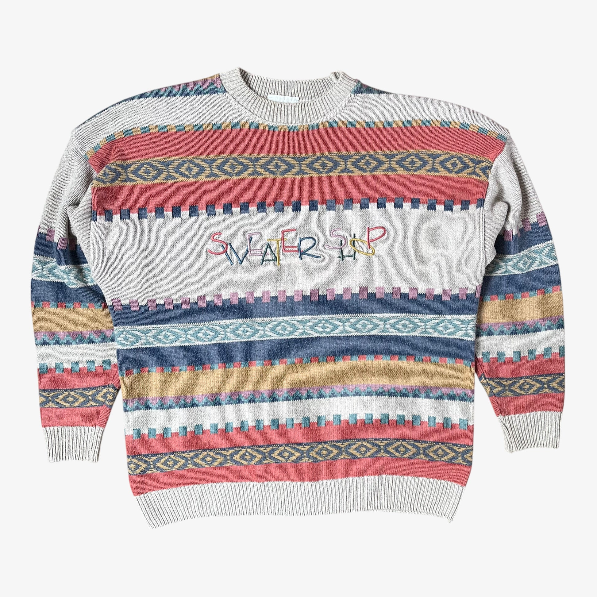 Colourful patterned sweater with 'Sweater Shop' text on a white background