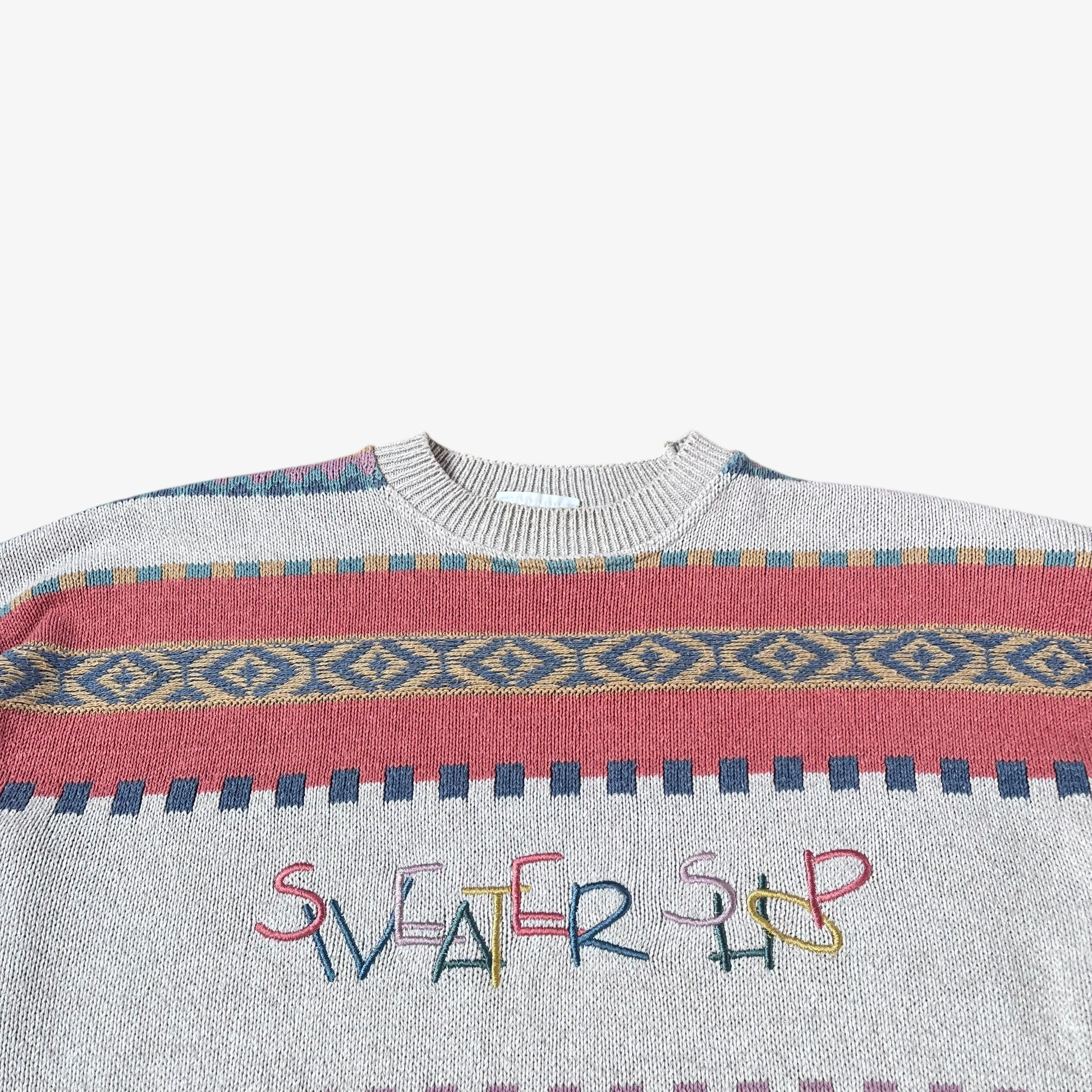 Sweater with colourful pattern and 'Sweater Shop' text on a white background