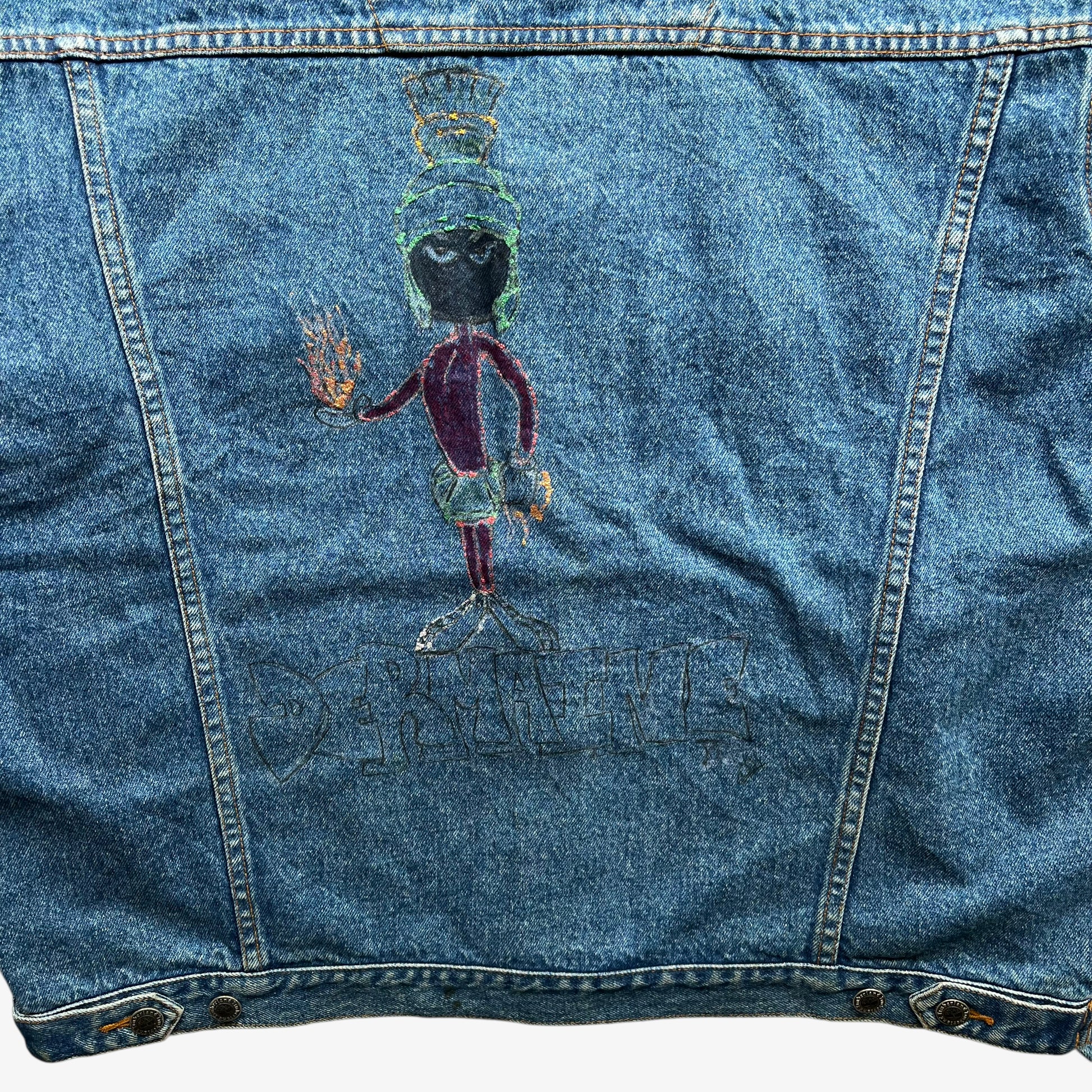 Looney Tunes Marvin the Martian print on the back of men's vintage 90s Timberland blue denim jacket with leather collar.