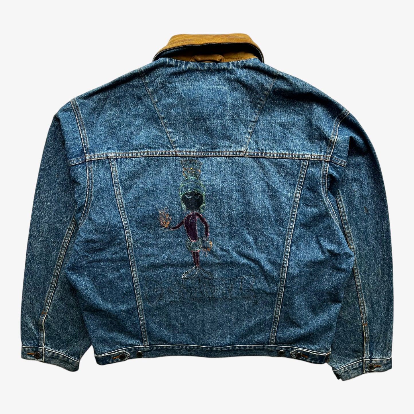 Back of men's vintage 90s Timberland blue denim jacket with leather collar and Looney Tunes Marvin Martian print.