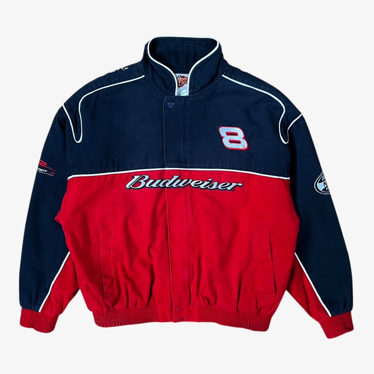 Vintage 90s Winner’s Circle Budweiser navy and red NASCAR jacket with embroidered spell-out logo and retro racing style.