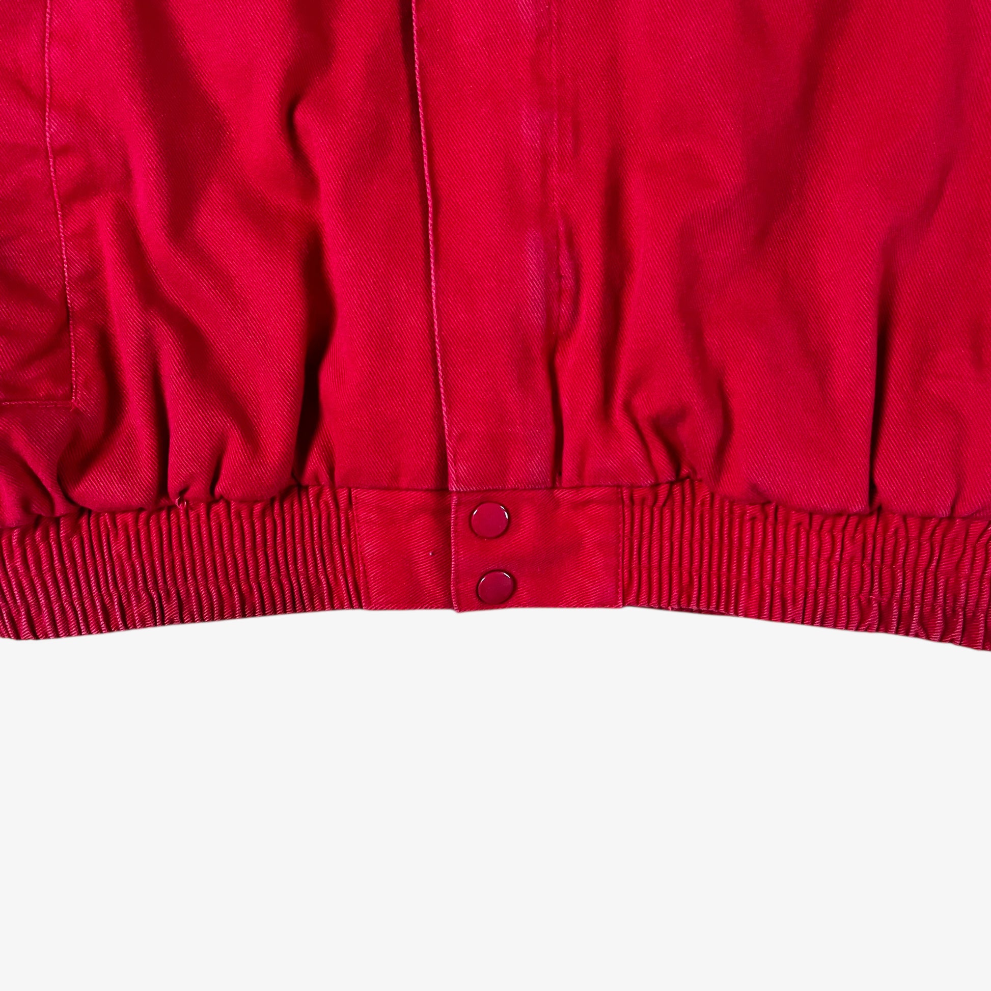 Hem of vintage 90s Winner’s Circle Budweiser navy and red NASCAR jacket.