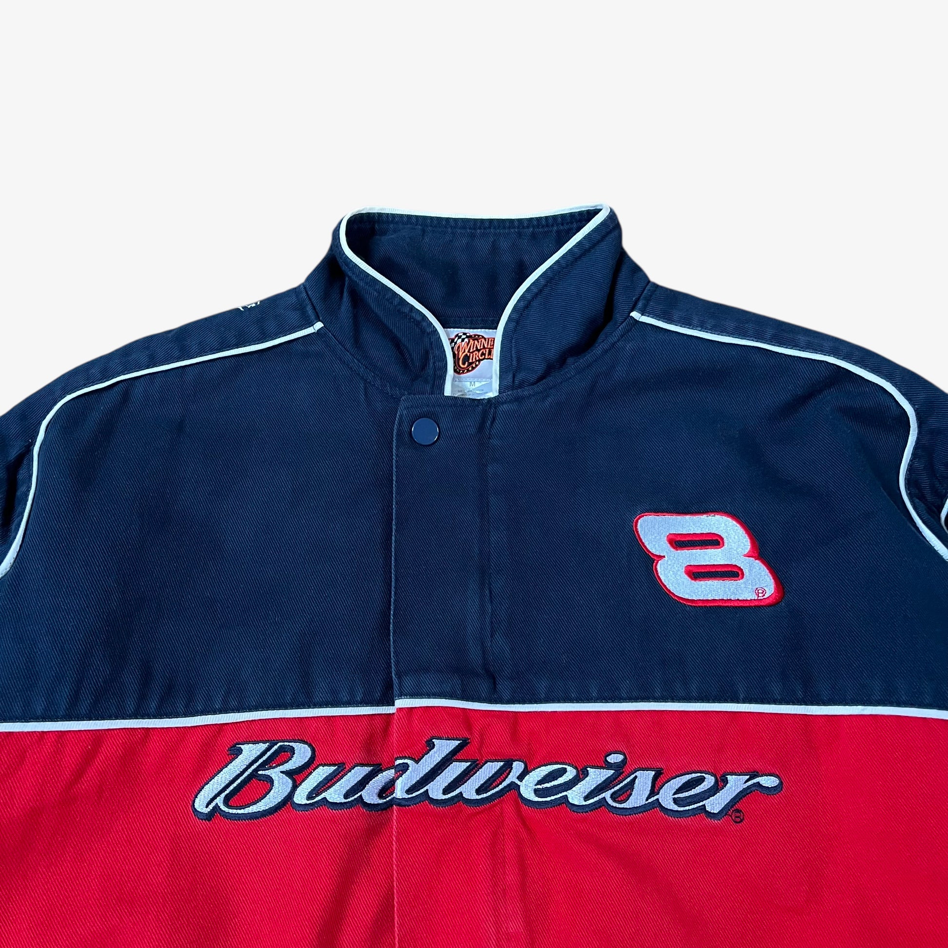 Close up of vintage 90s Winner’s Circle Budweiser navy and red NASCAR jacket.