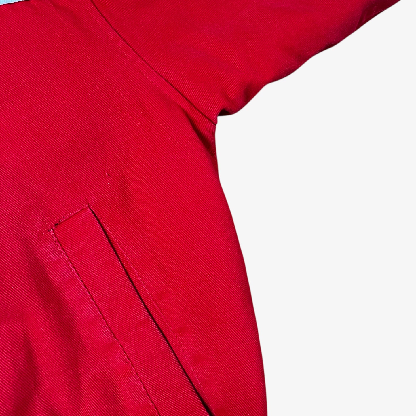 Pocket of vintage 90s Winner’s Circle Budweiser navy and red NASCAR jacket.