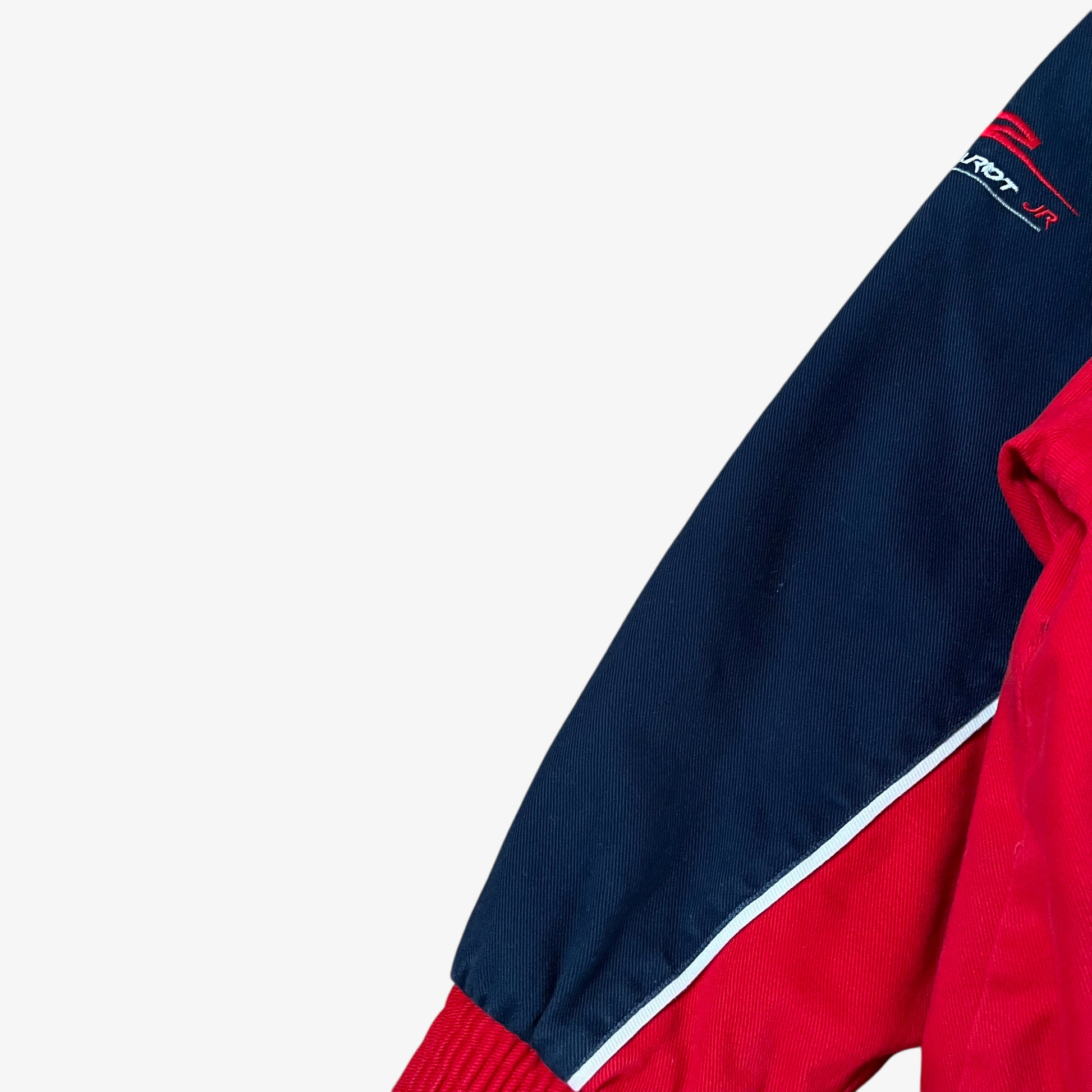 Sleeve of vintage 90s Winner’s Circle Budweiser navy and red NASCAR jacket.