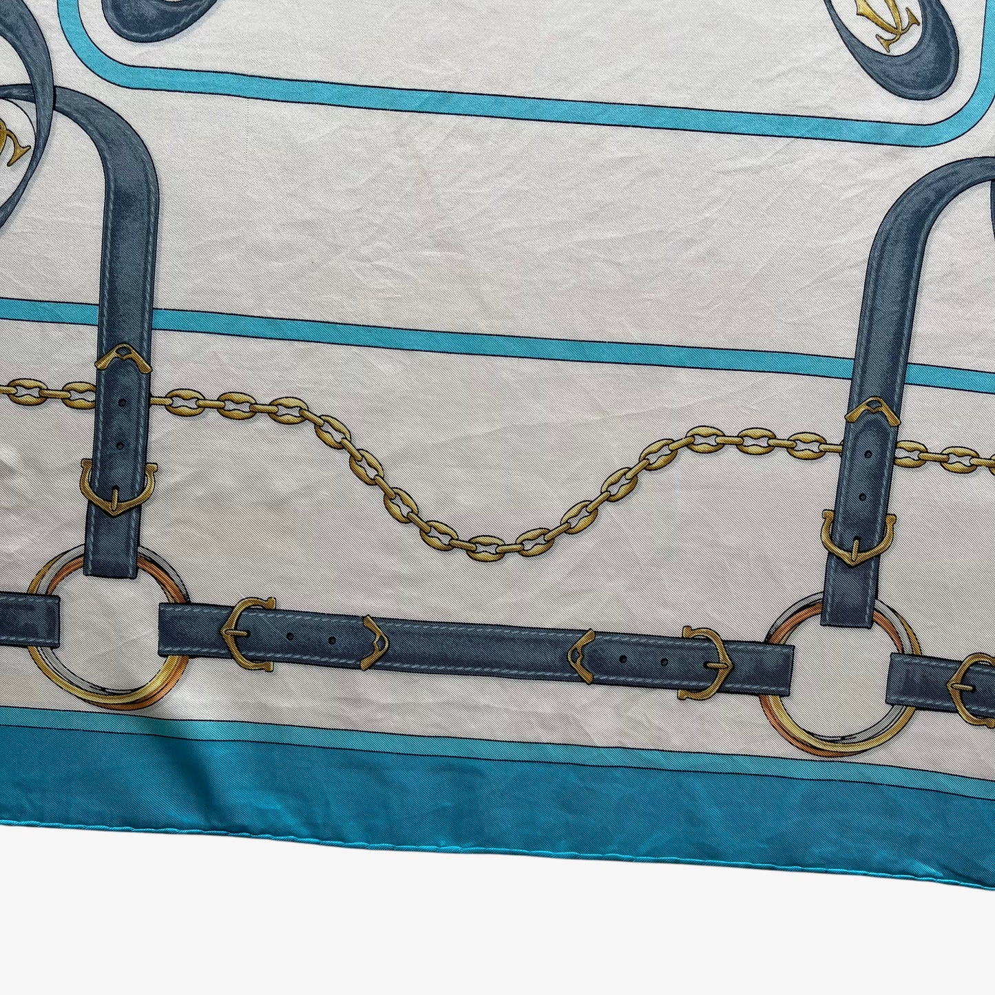 Chain print on women's vintage 90s must de Cartier equestrian strap print blue silk scarf featuring the classic CC logo.