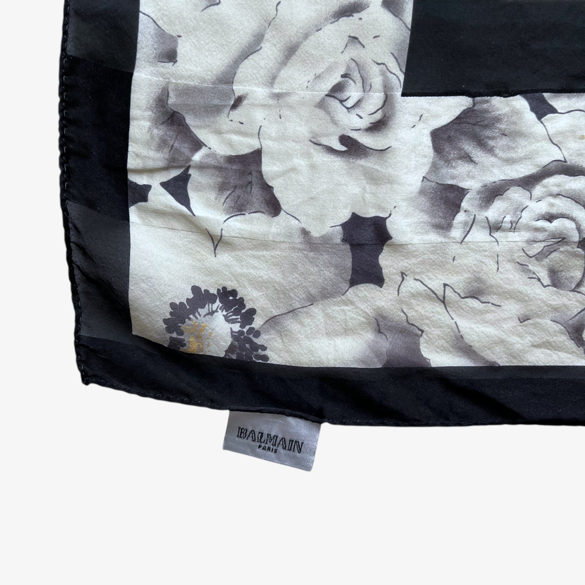 Balmain Paris label on women's vintage 90s all over floral print silk scarf.