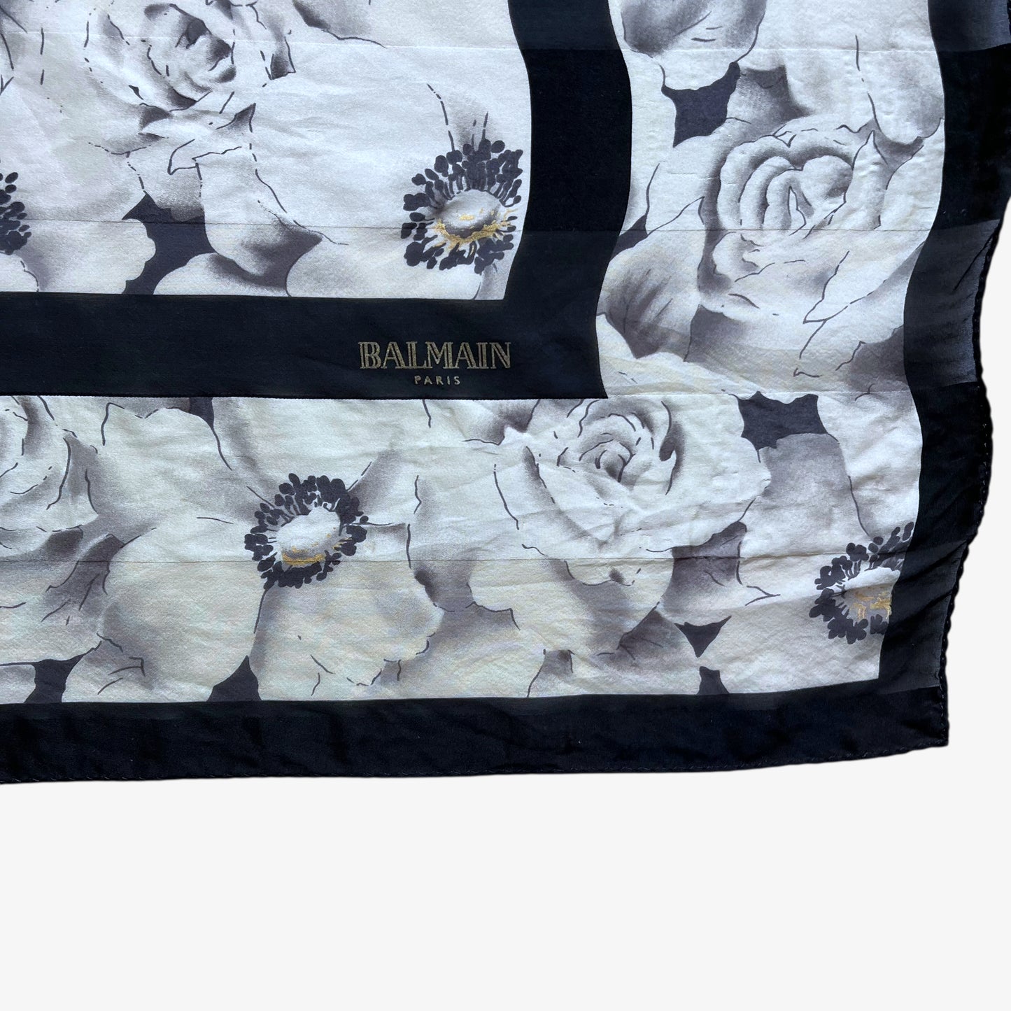 Balmain Paris spell out logo on women's vintage 90s all over floral print silk scarf.