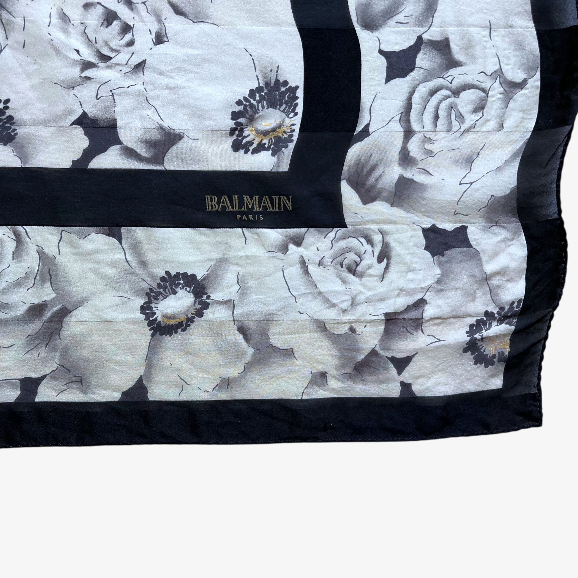 Balmain Paris spell out logo on women's vintage 90s all over floral print silk scarf.