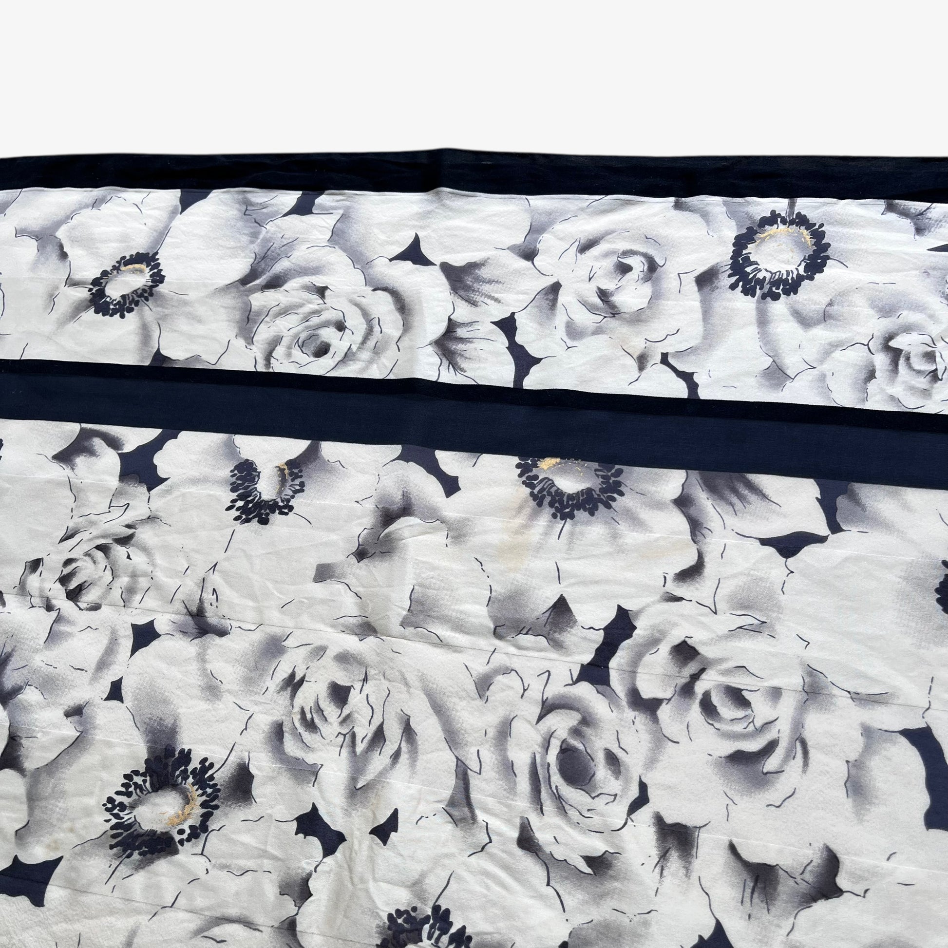 Patina on women's vintage 90s Pierre Balmain Paris all over floral print silk scarf.