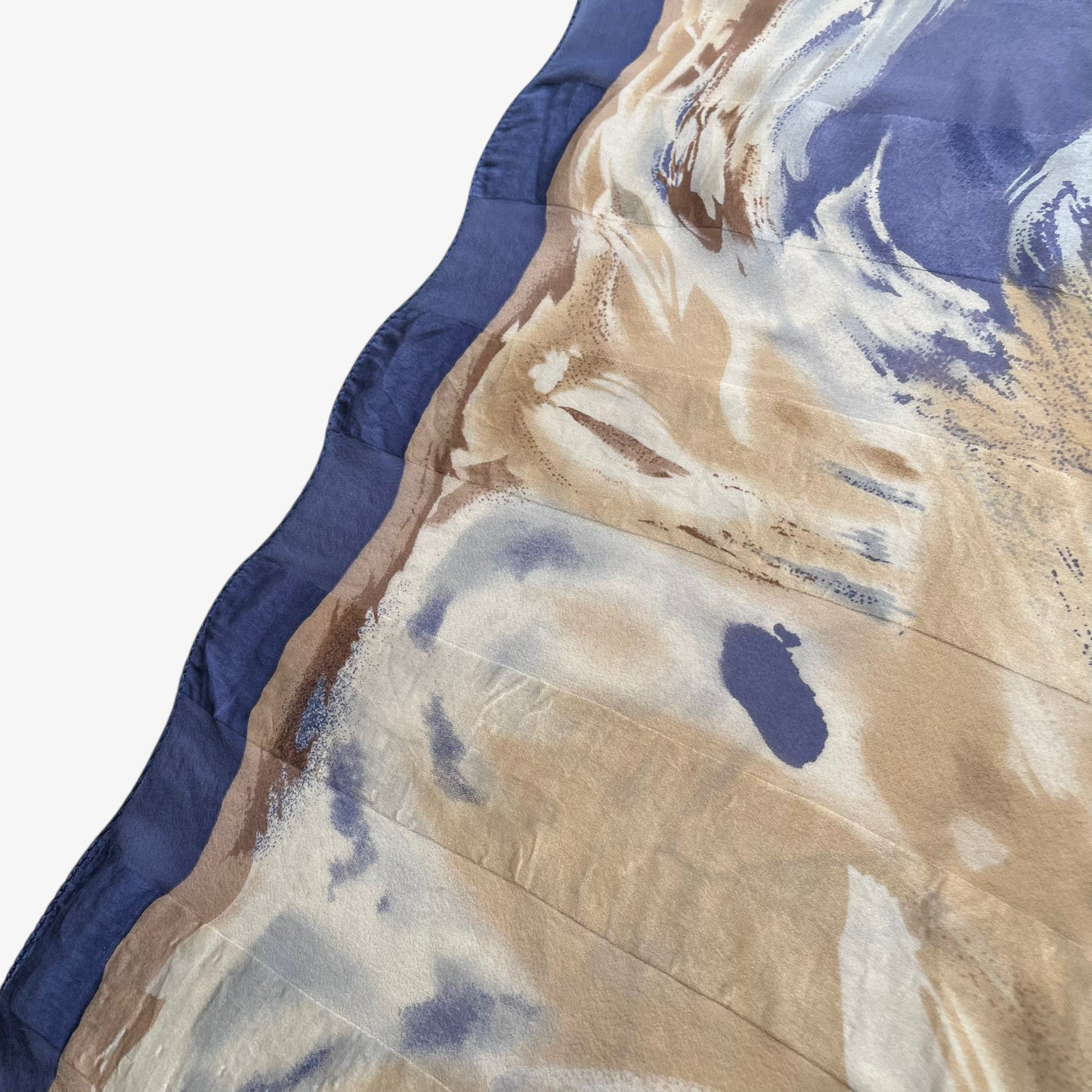 Hem of women's vintage 90s Pierre Balmain Paris floral oil painting print yellow and blue silk scarf.