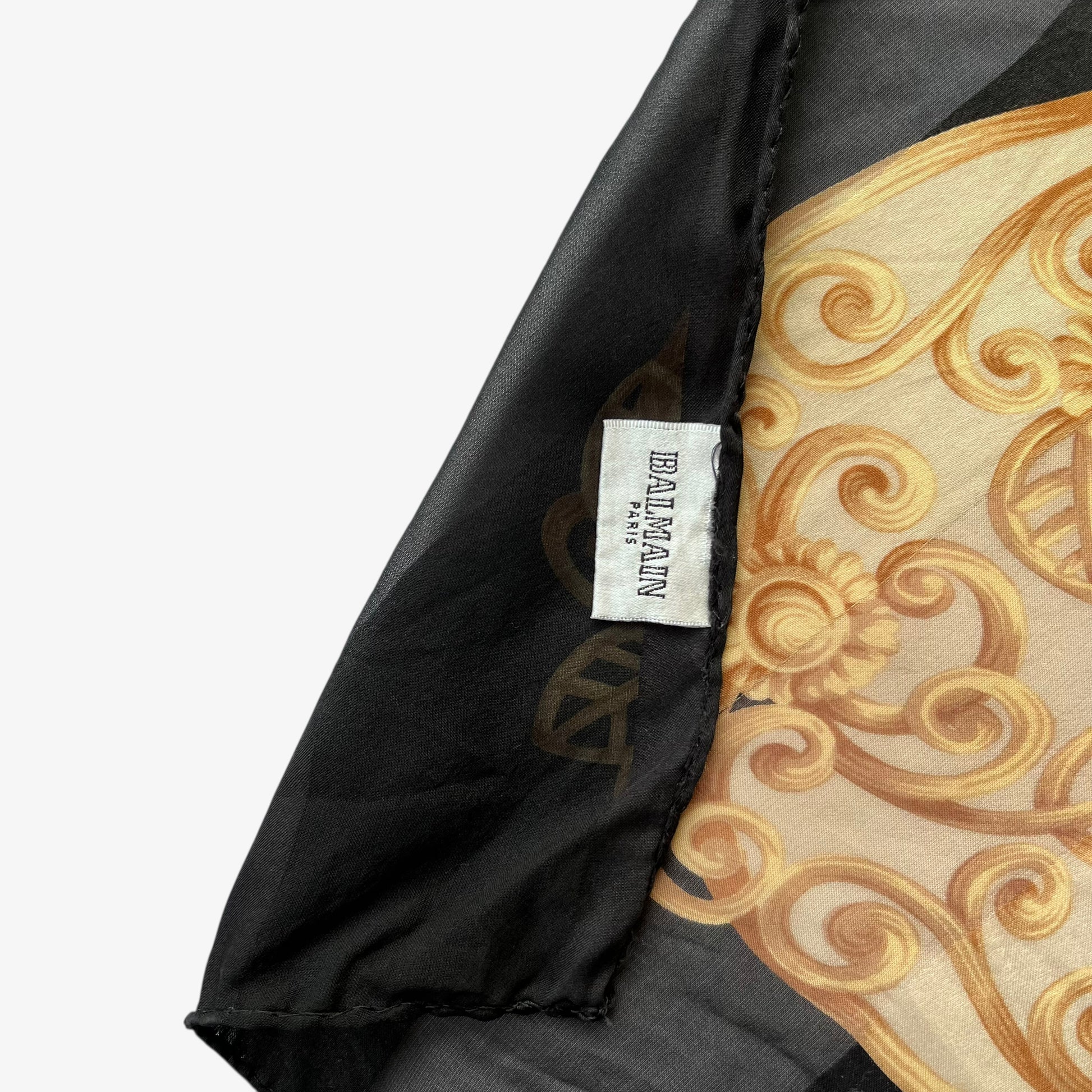 Balmain Paris label on women's vintage 90s yellow floral rose print striped black silk scarf.