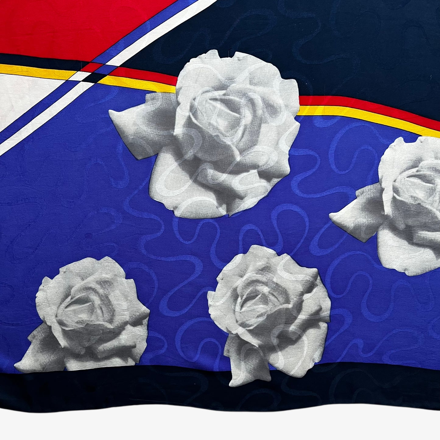 Large floral print on a women's vintage 90s Pierre Cardin colourful Mondrian styled print silk scarf.